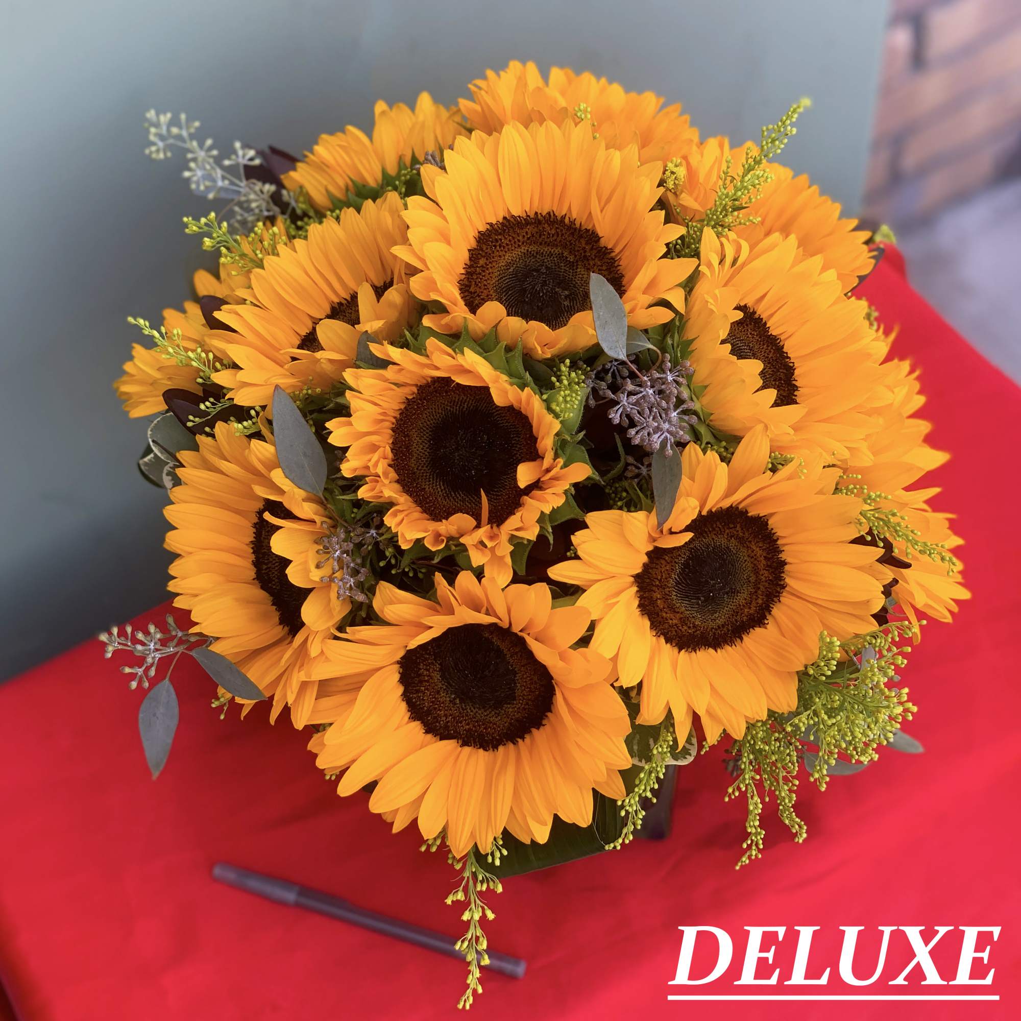 A pretty design of Sunflowers and Greens. 