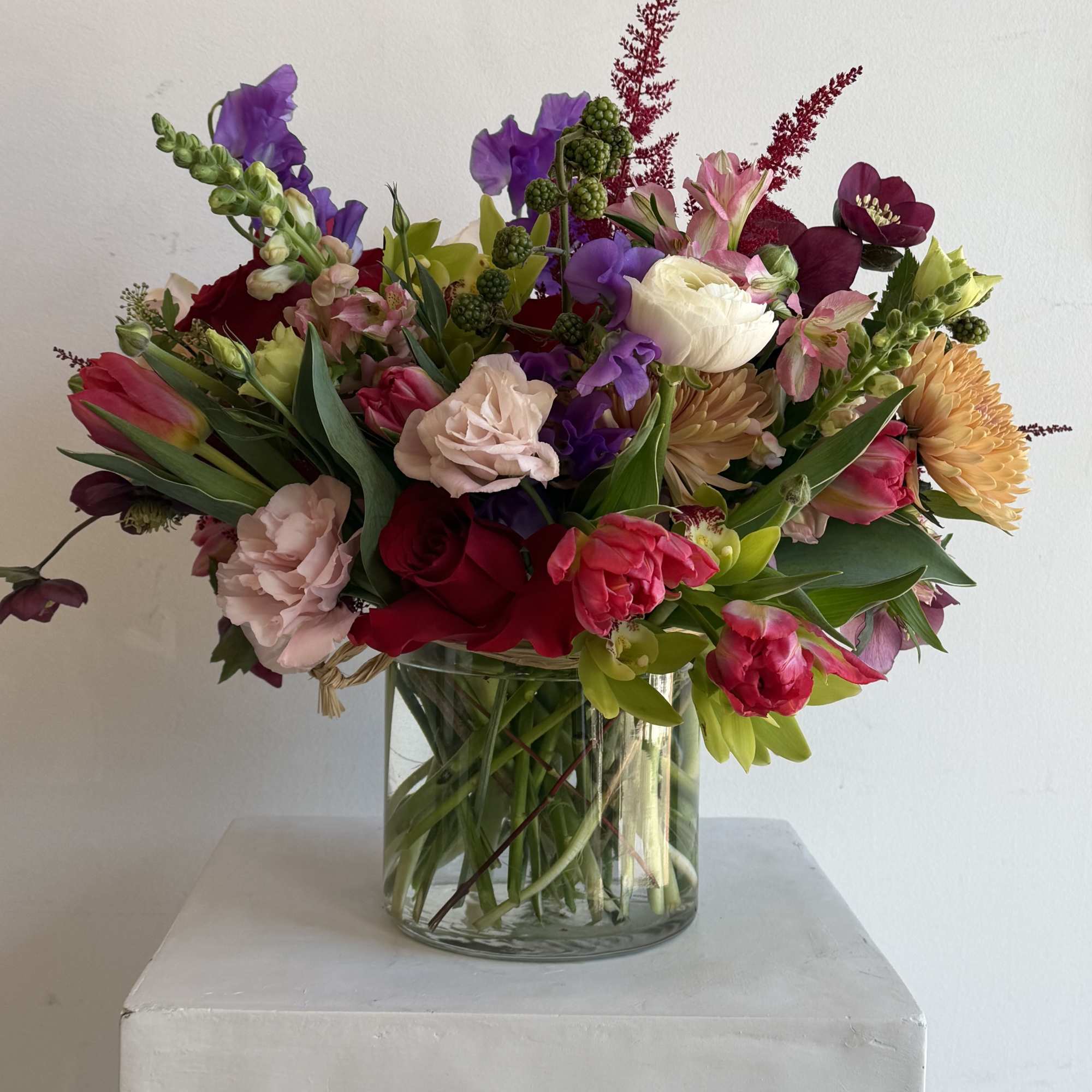 Colorful mixed bouquet in a clear glass vase