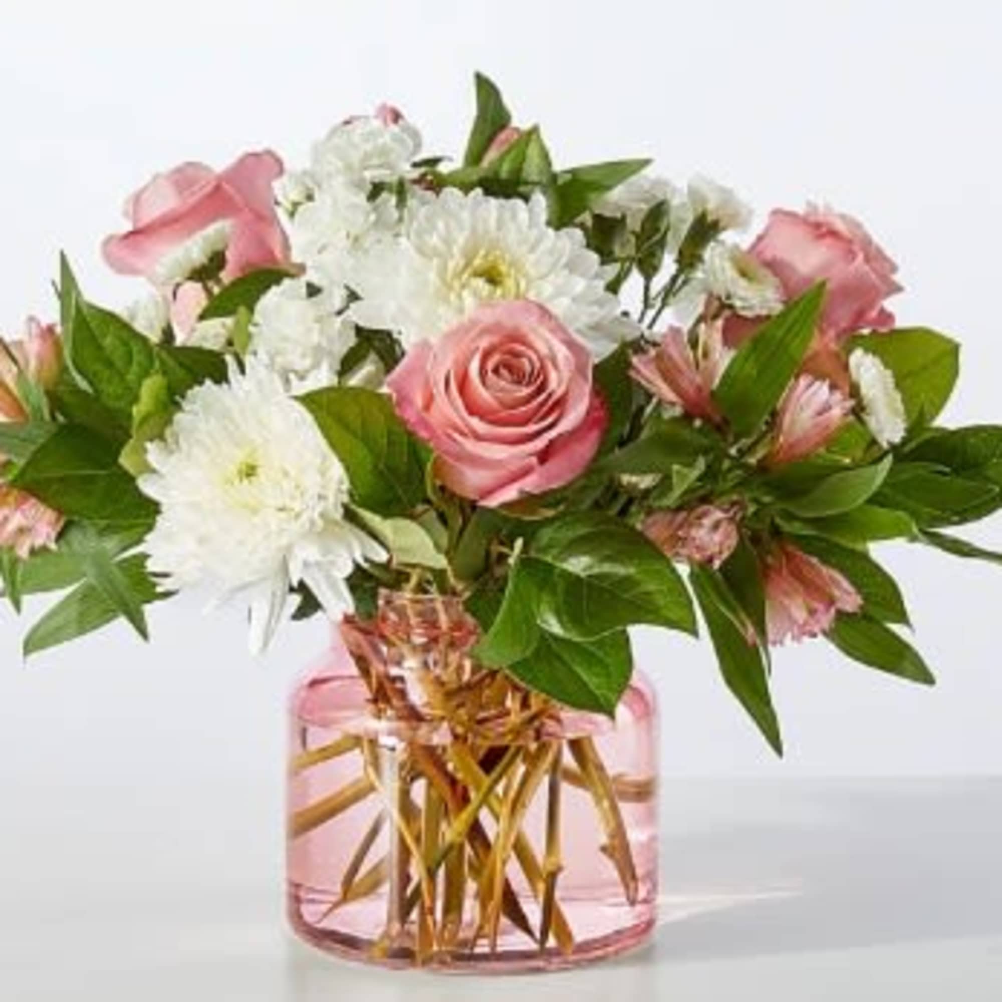 Your recipient will be falling for these blushing alstroemeria and white mums