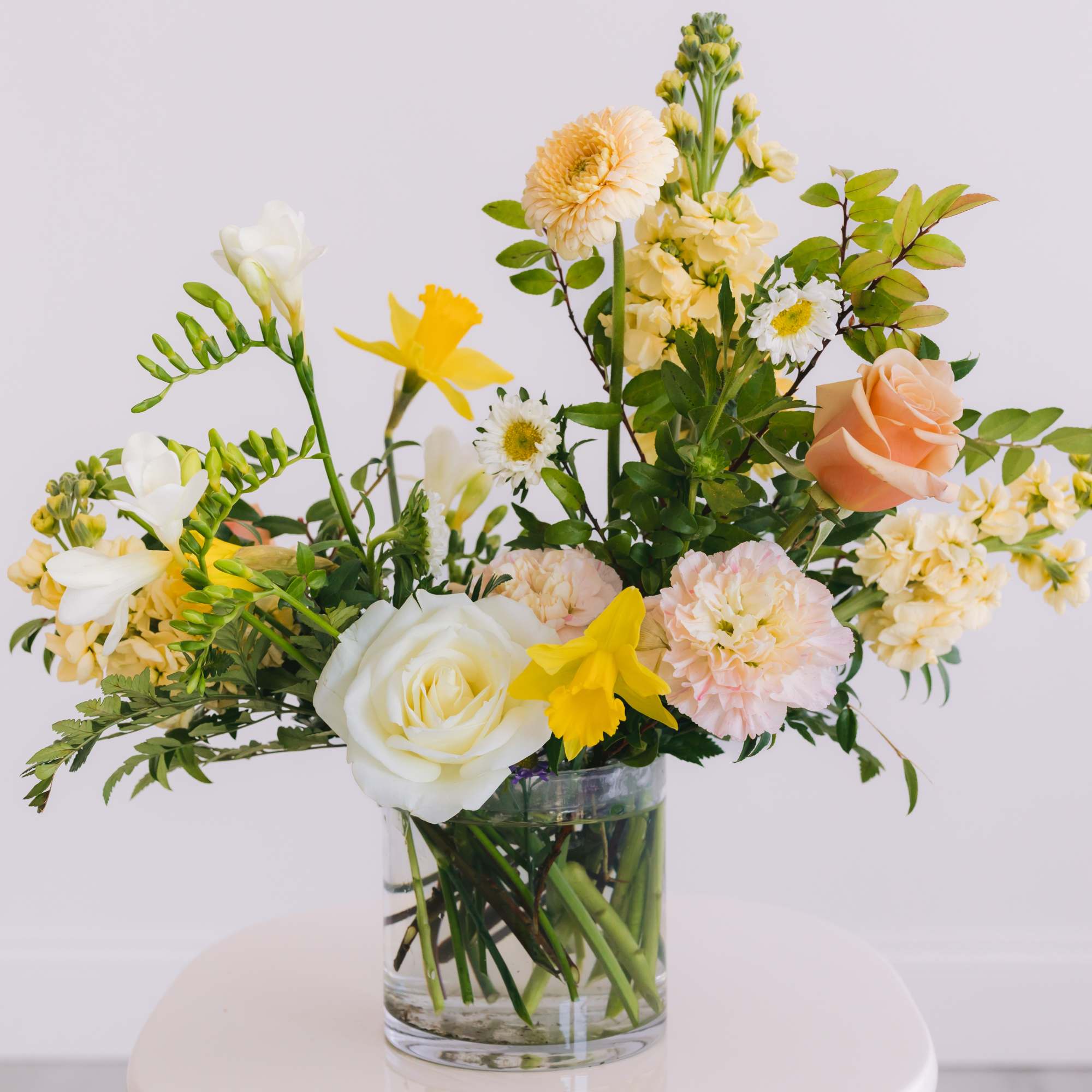 Designed in our signature style: a lush garden-style mix of seasonal blooms