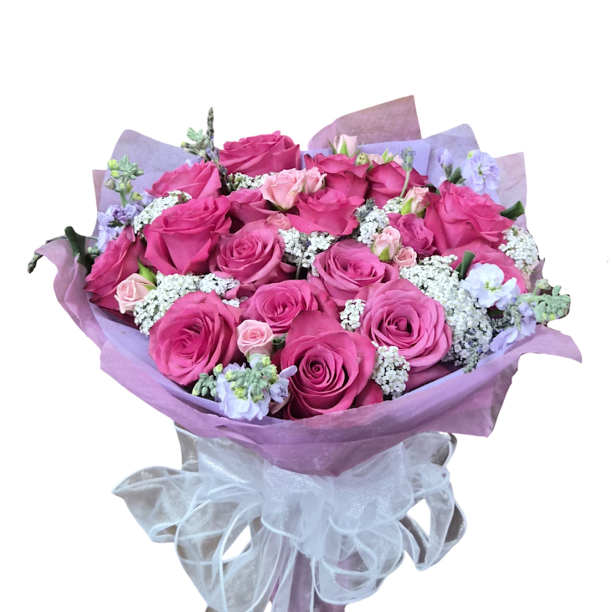 A lush cluster of bright pink roses takes center stage in this