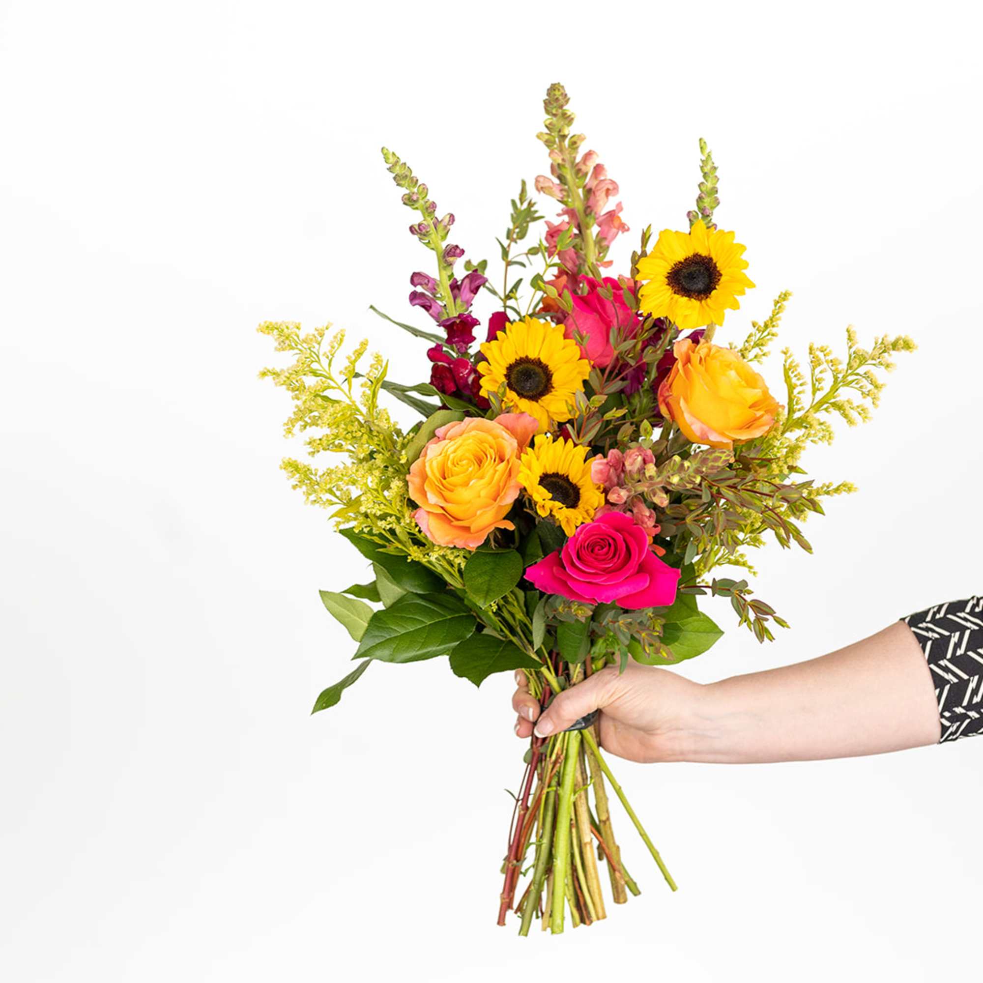 Handheld bouquet of sunflowers and roses in bright mixed colors