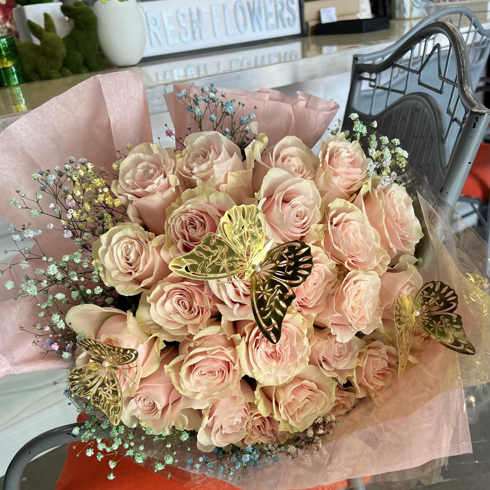 A cloud of pale blush-pink roses makes an immediate, romantic impression in