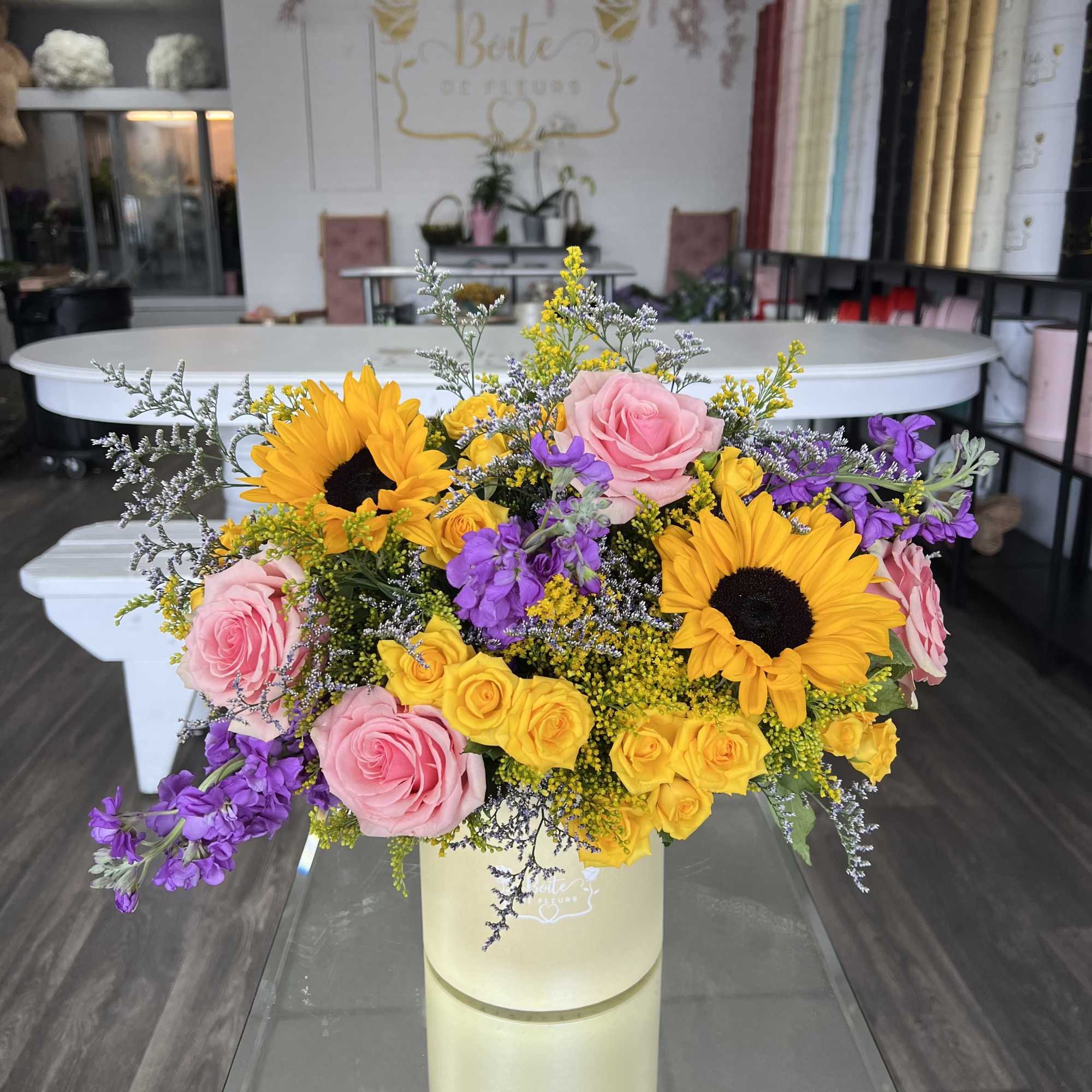 A little box of sunshine with a playful twist. Bursting with sunflowers