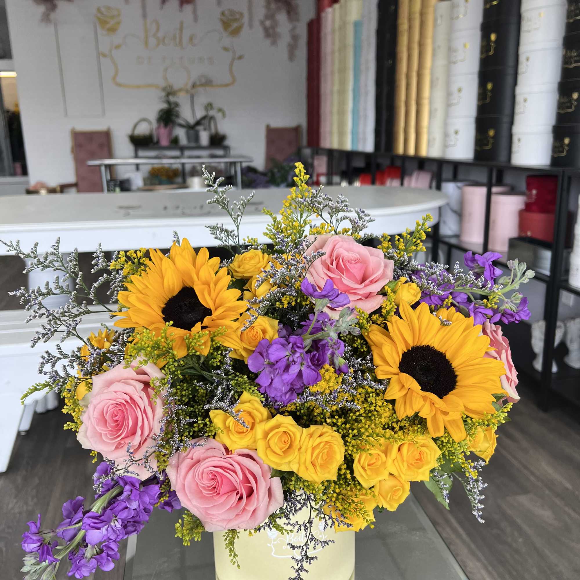 A little box of sunshine with a playful twist. Bursting with sunflowers