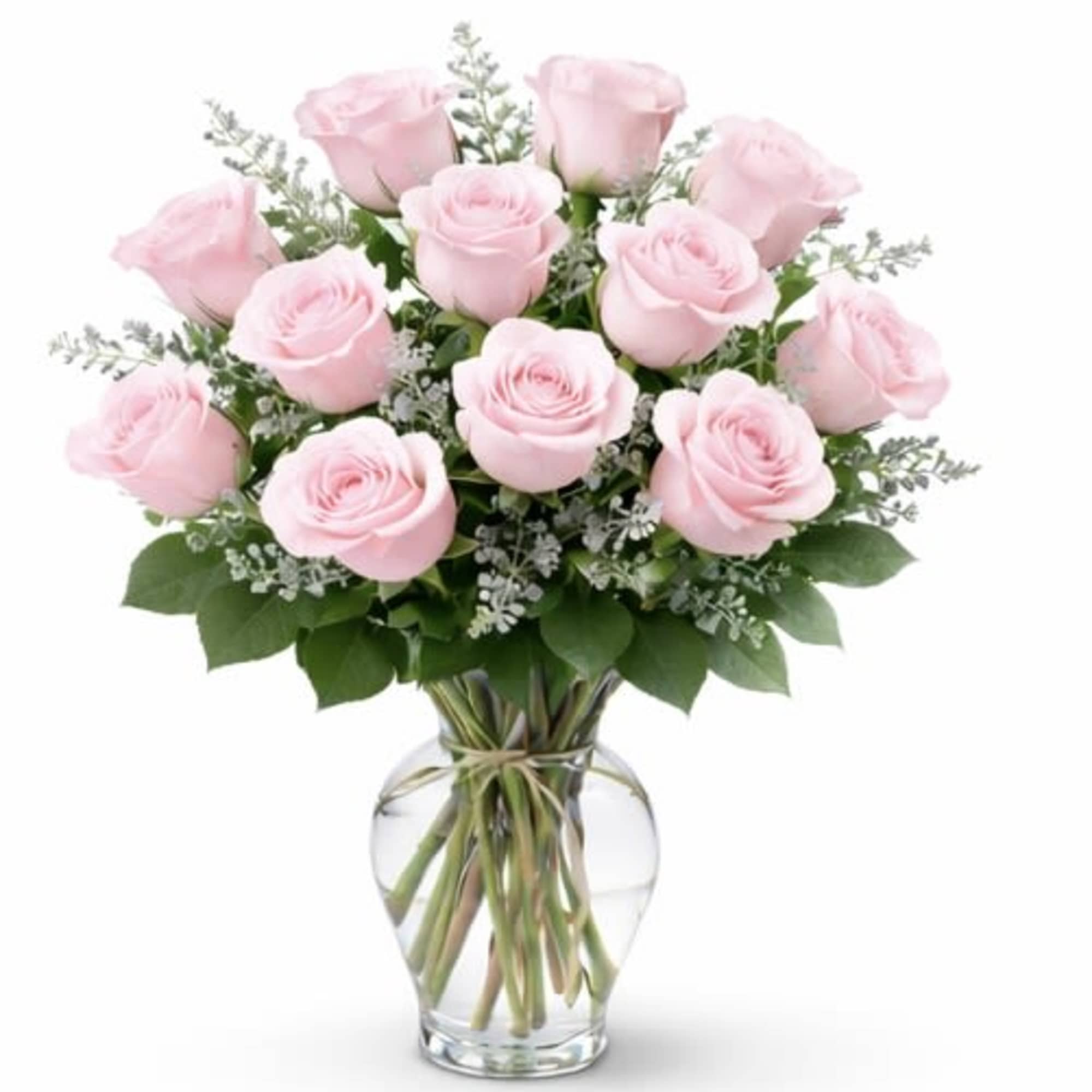 Pink roses arranged in a clear glass vase