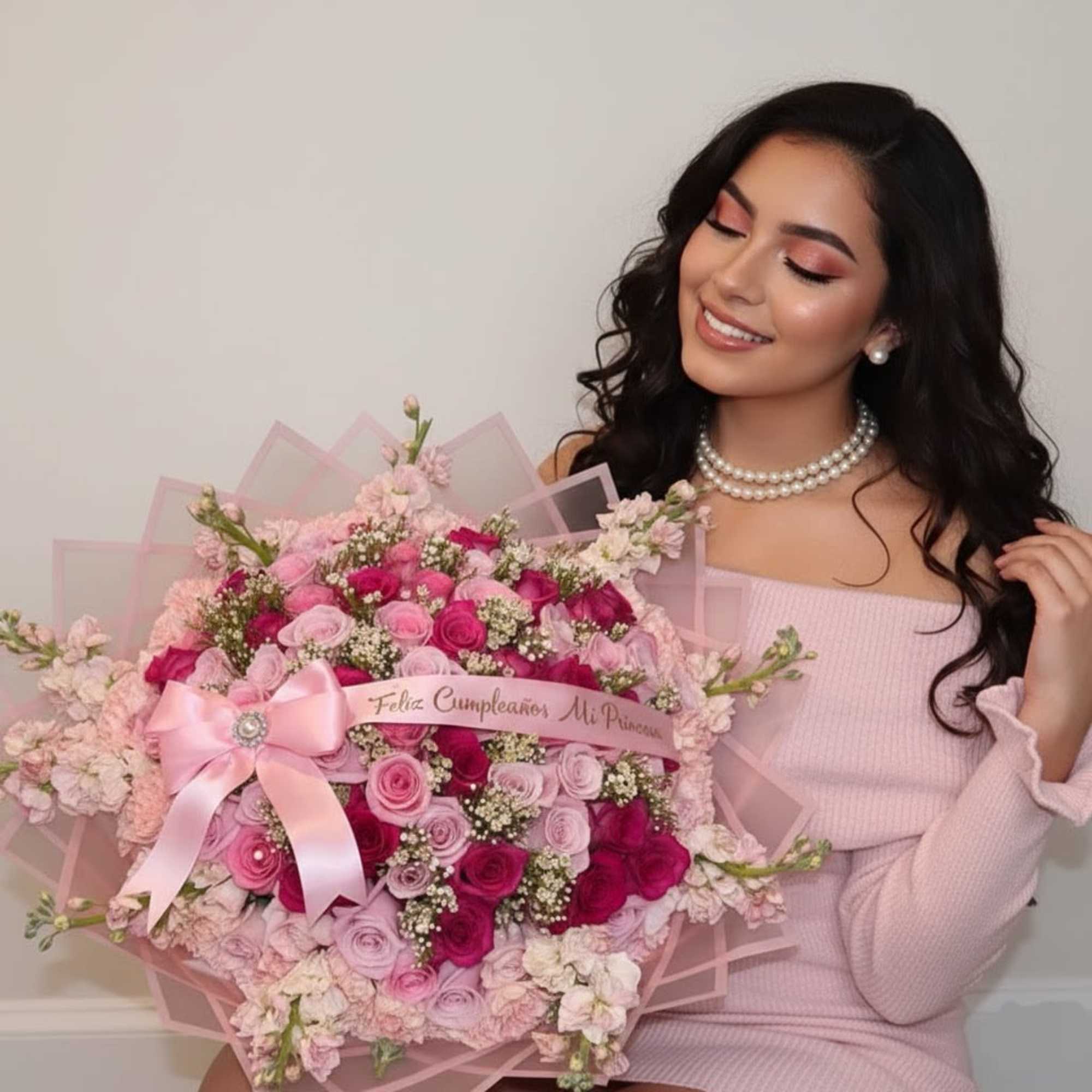 Large pink bouquet with roses and a satin bow