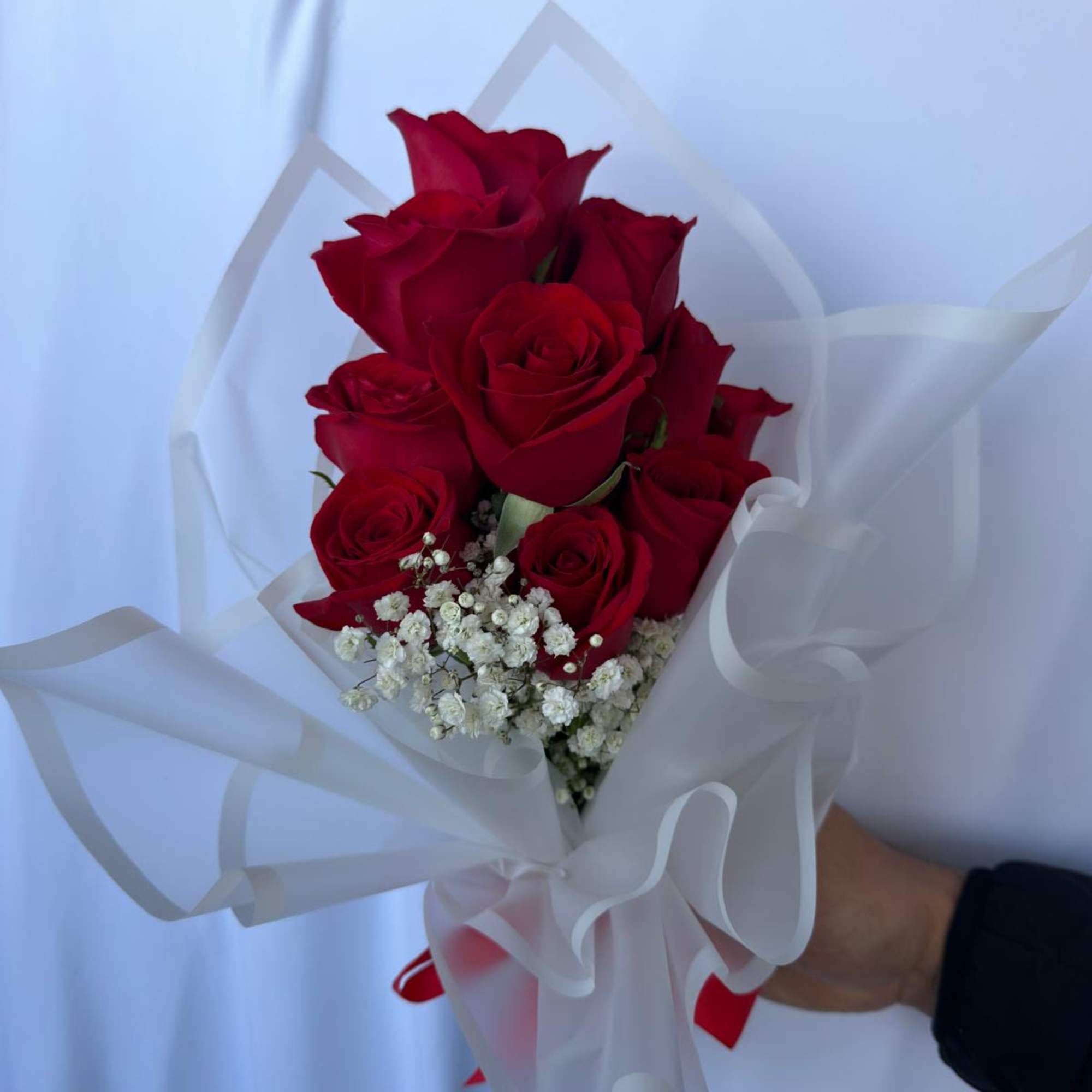 A timeless classic: 12 fresh red roses, carefully selected and wrapped in