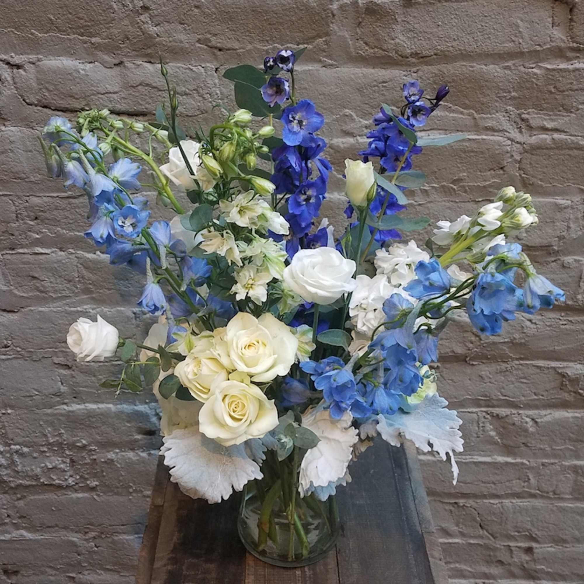 A sweet design in various shades of blues, whites and greens, featuring