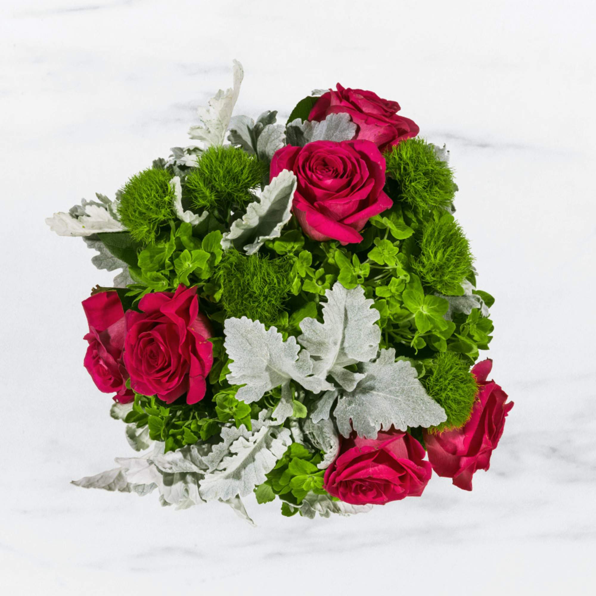Bouquet of hot pink roses with green and silver foliage