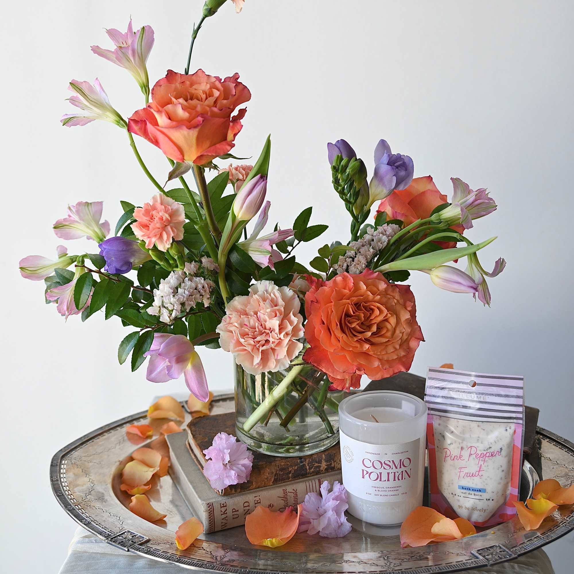 This bundle pairs a small arrangement with a hand-selected Rewined candle and