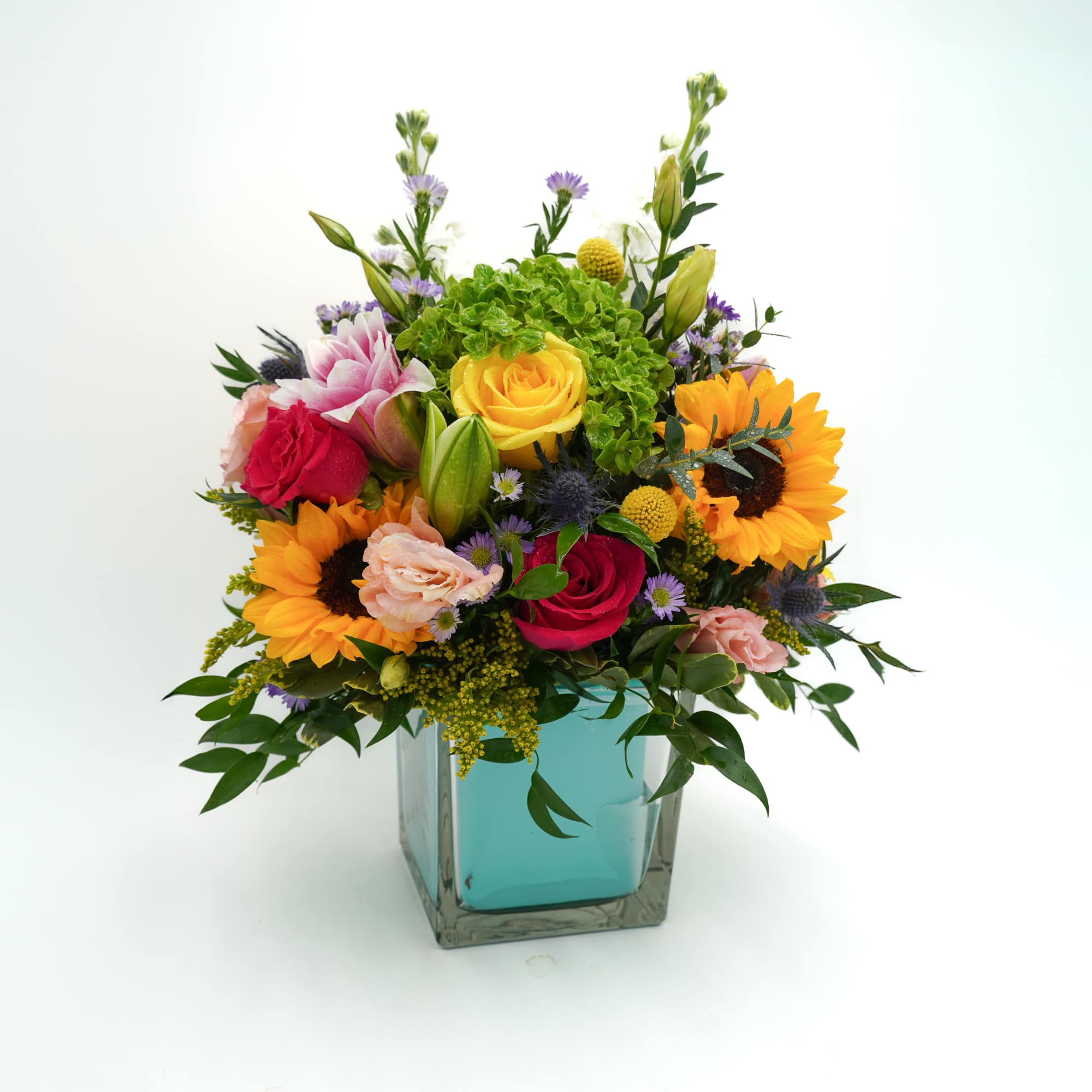 Brighten any space with this vibrant, garden-inspired arrangement featuring radiant sunflowers, classic