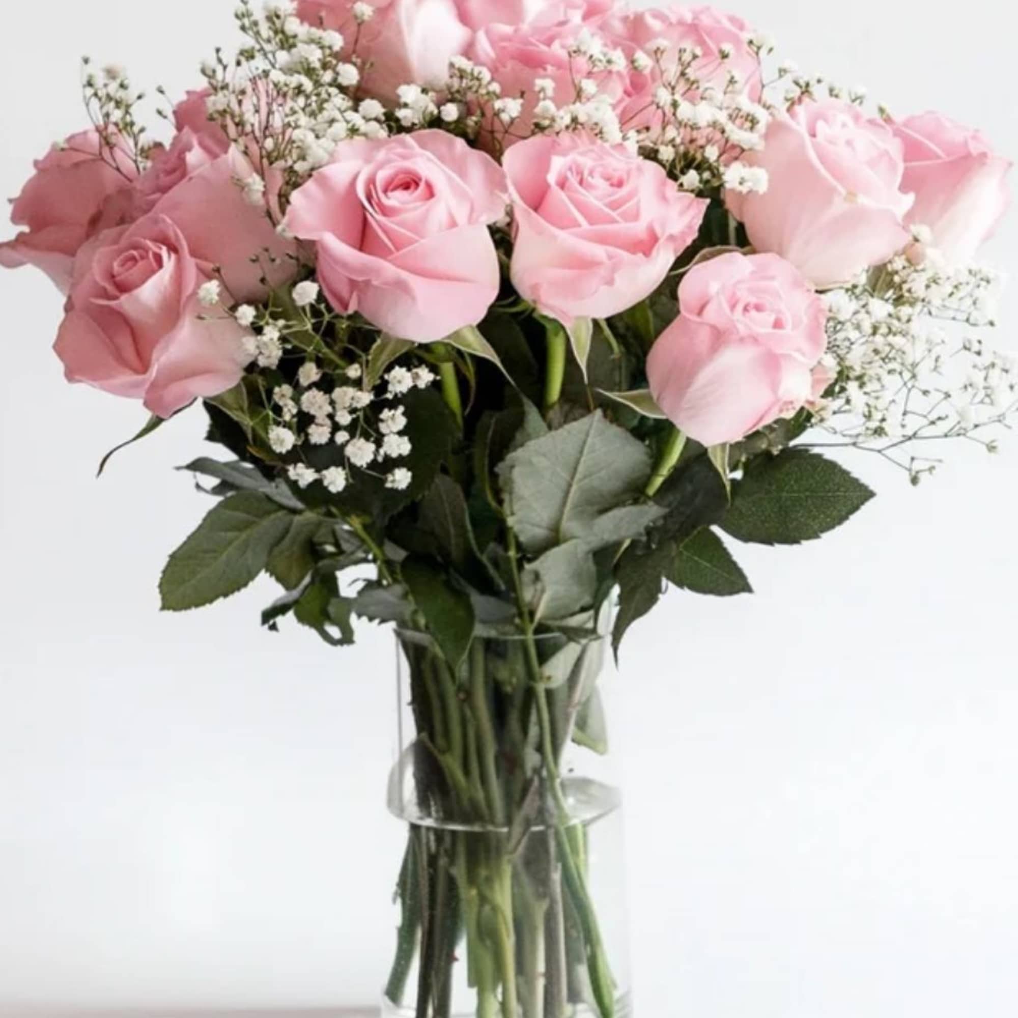 Delicate and timeless, the Blush Serenity Bouquet features 12 soft pink roses