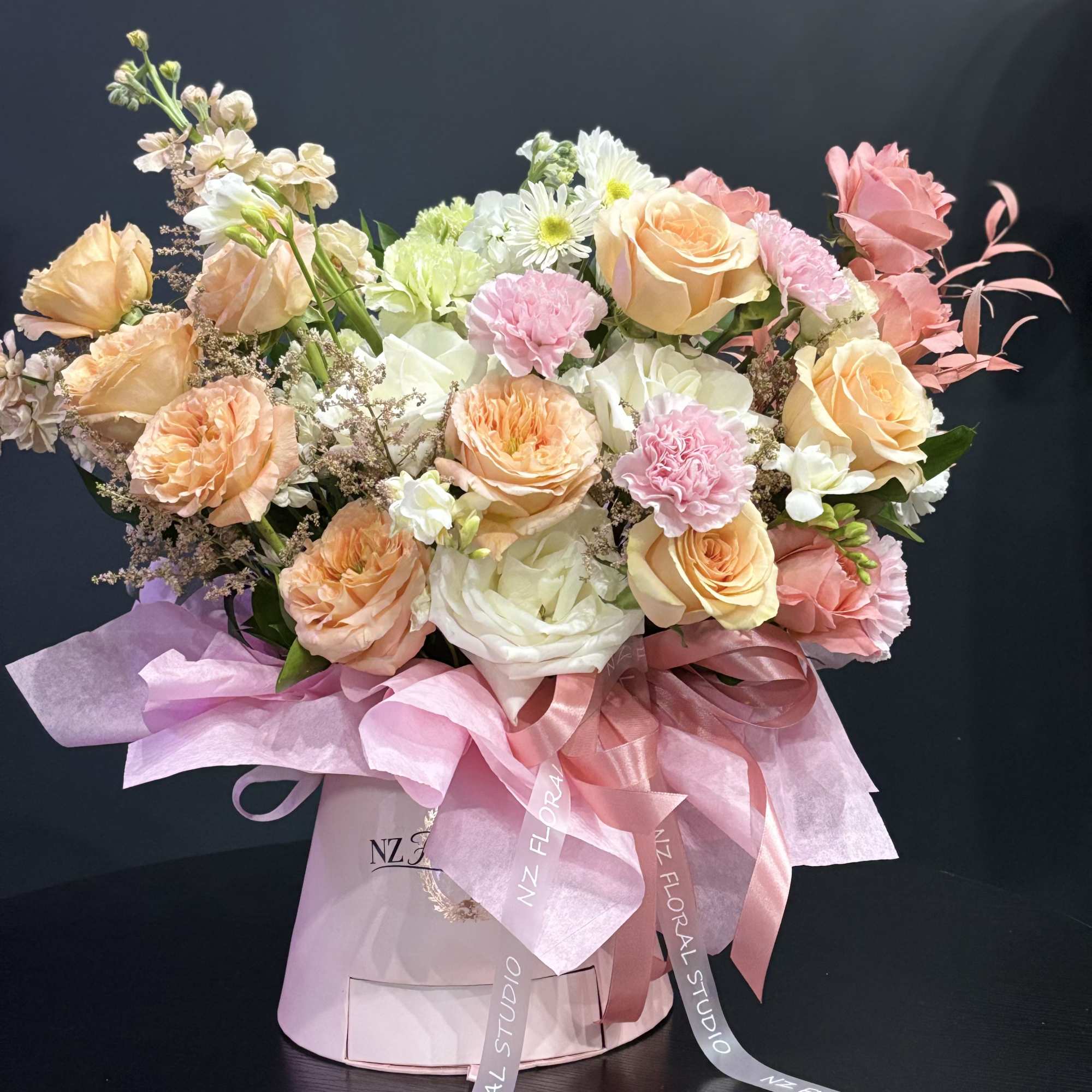 Blush Garden is a delicate, garden-inspired arrangement designed in soft pastel tones