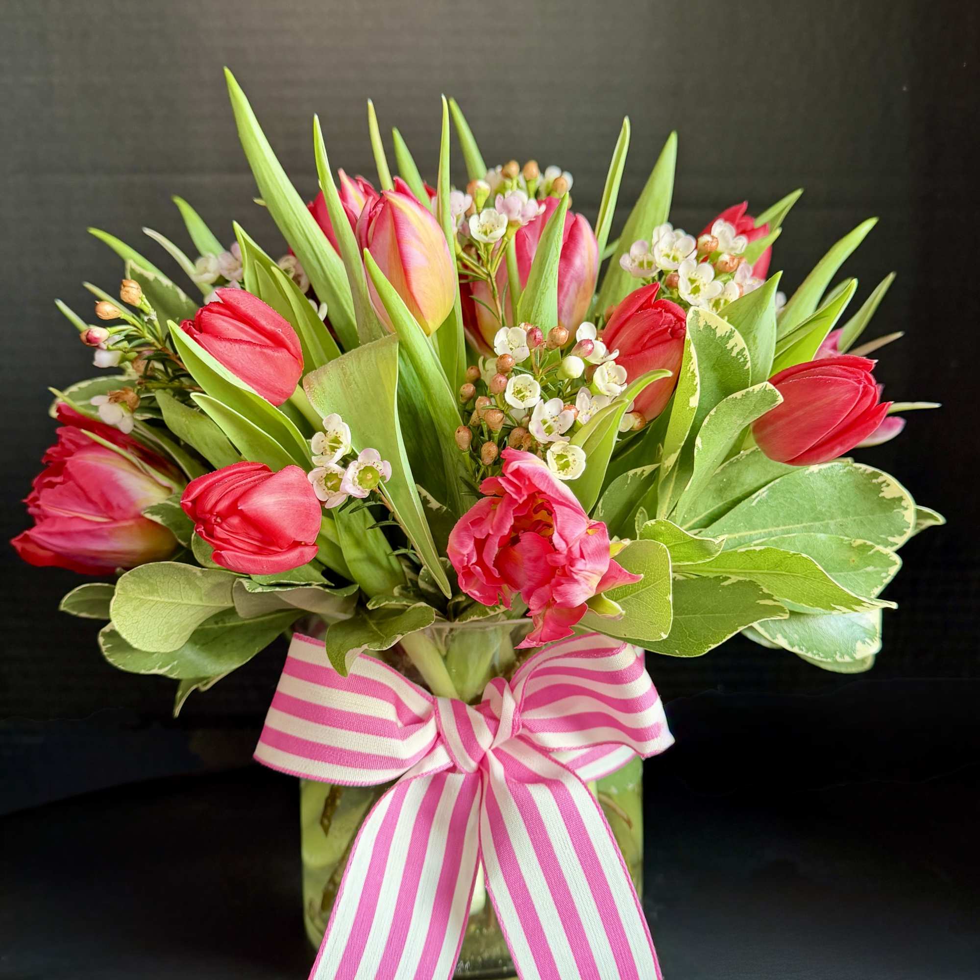 20 Tulips designed in vase with ribbon.
