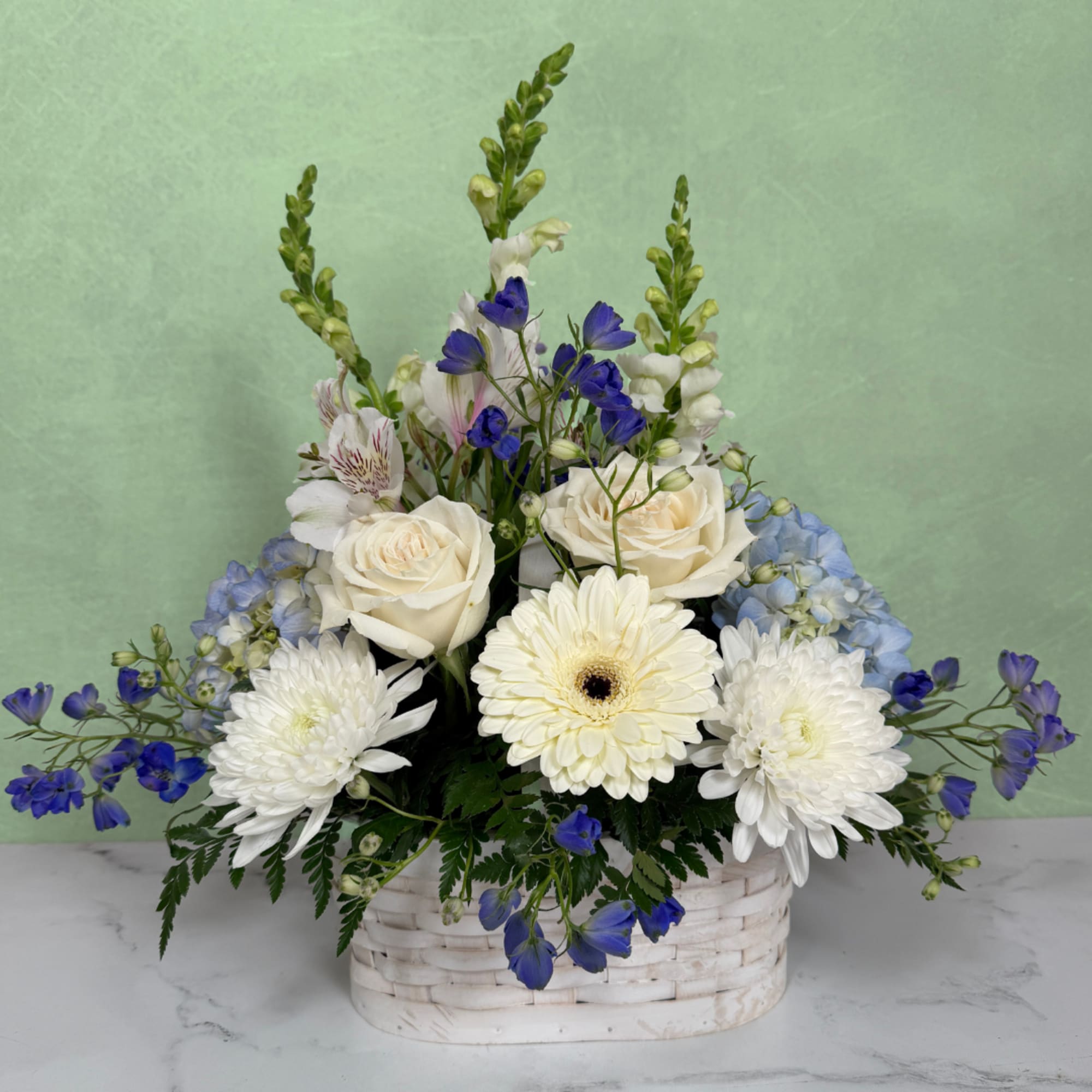 Whispering Winds Basket by Savilles Florist is a basket full of stunning