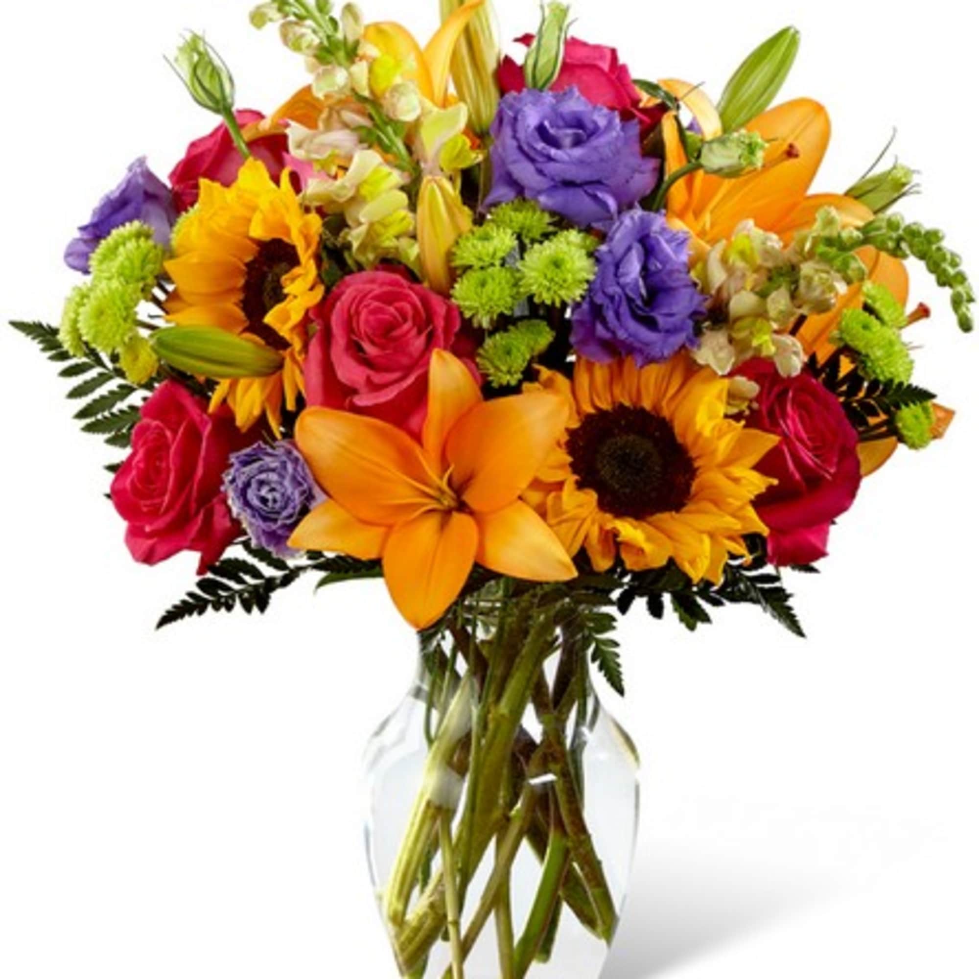 Colorful bouquet of roses, lilies, and sunflowers in a clear glass vase