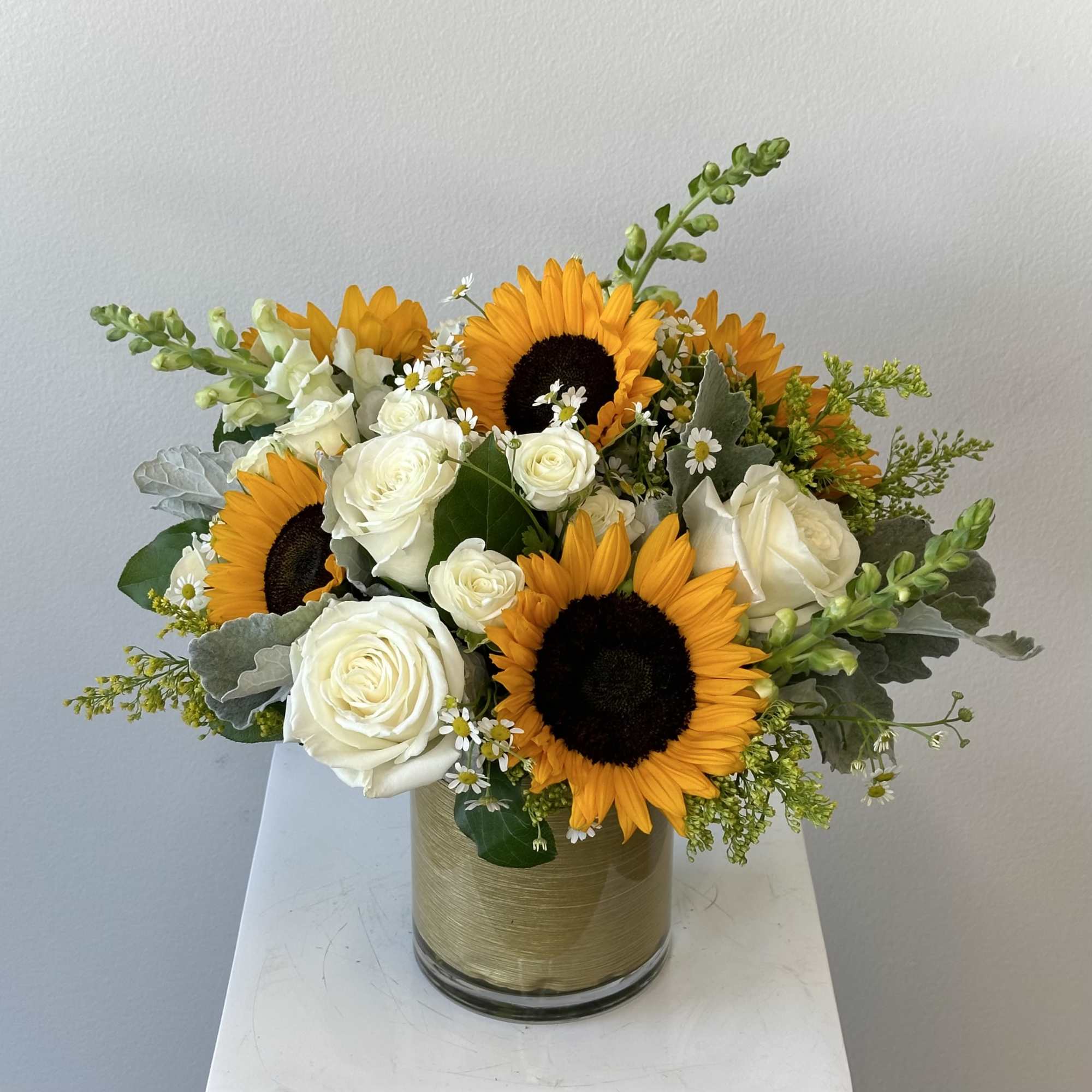 Discover the radiant beauty of our Golden Sunrise flower arrangement, a stunning