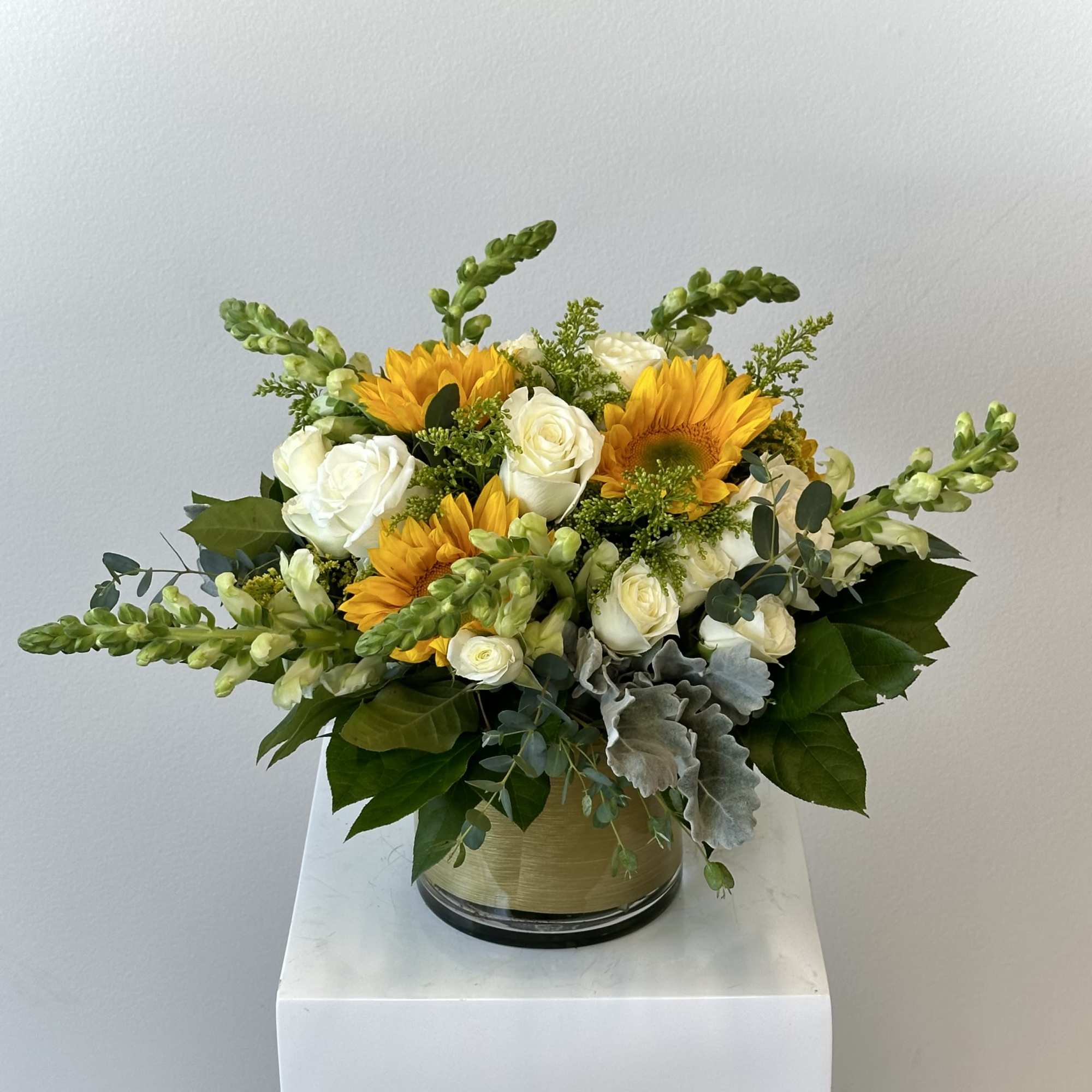Discover the radiant beauty of our Golden Sunrise flower arrangement, a stunning