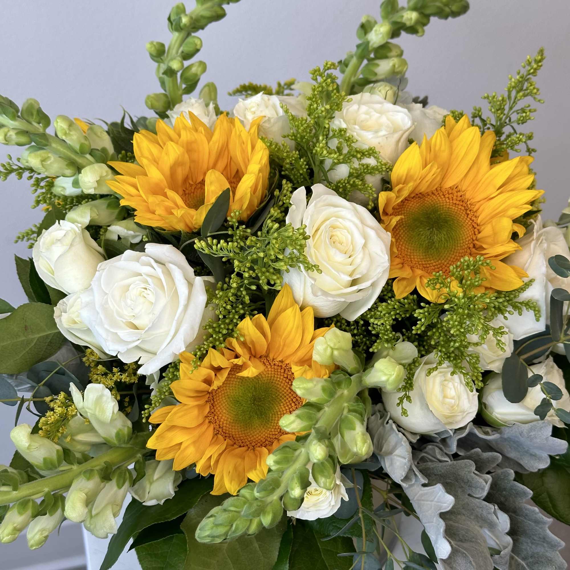 Discover the radiant beauty of our Golden Sunrise flower arrangement, a stunning