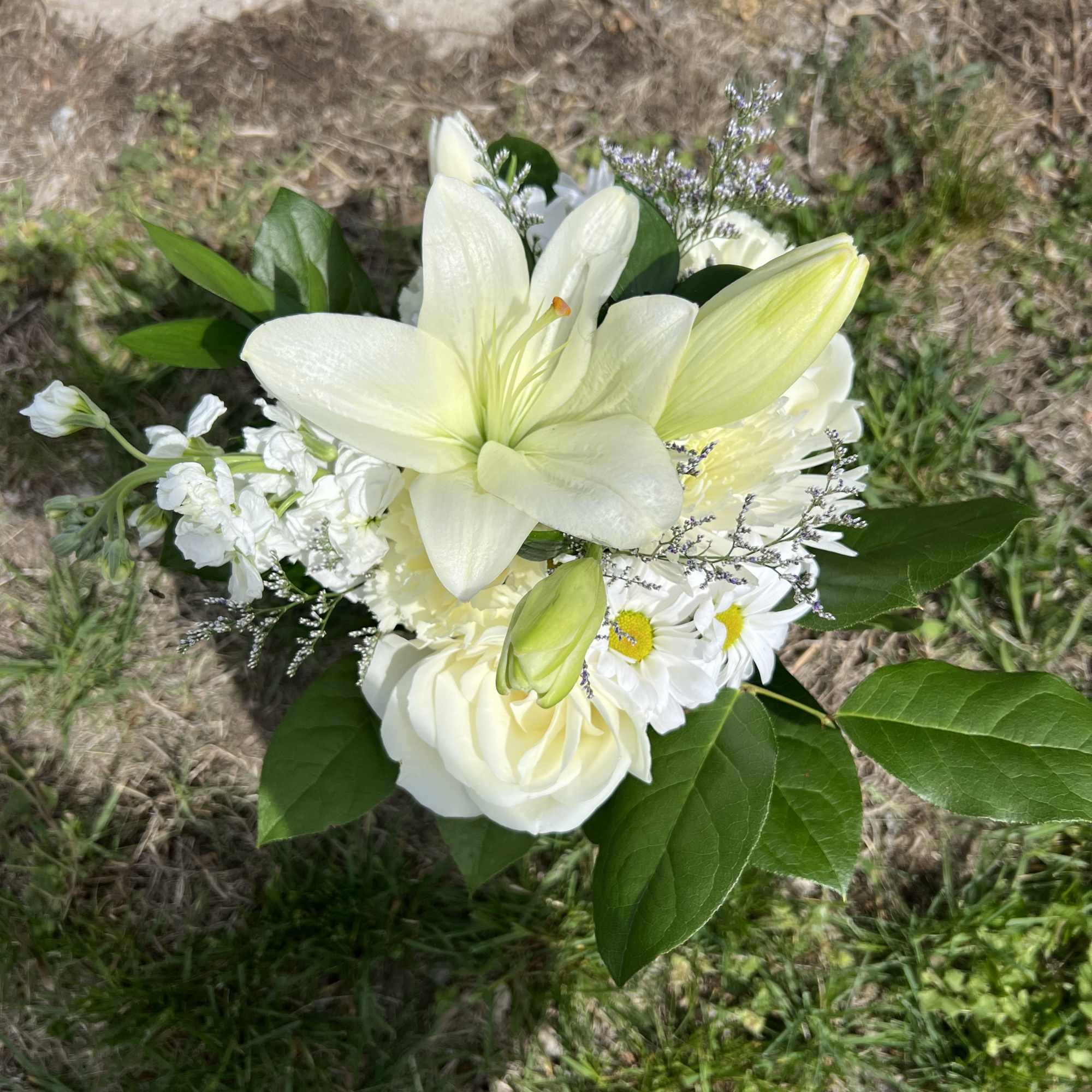 An elegant hand-tied bouquet that will compliment any prom outfit. Filled with