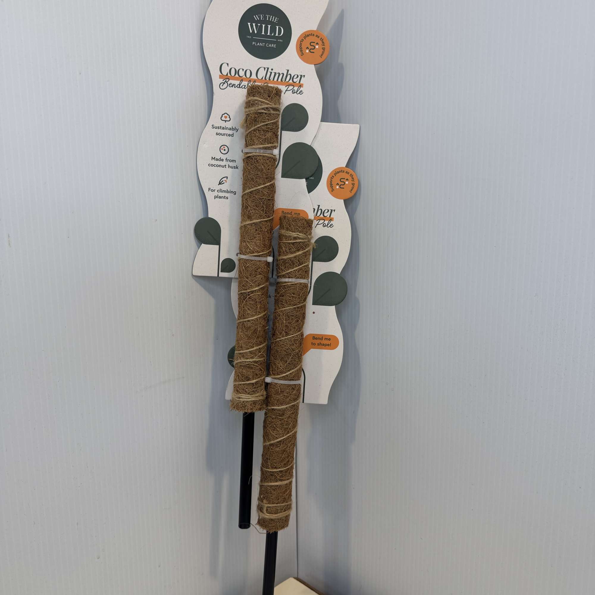 Packaged coco climber plant support poles on display