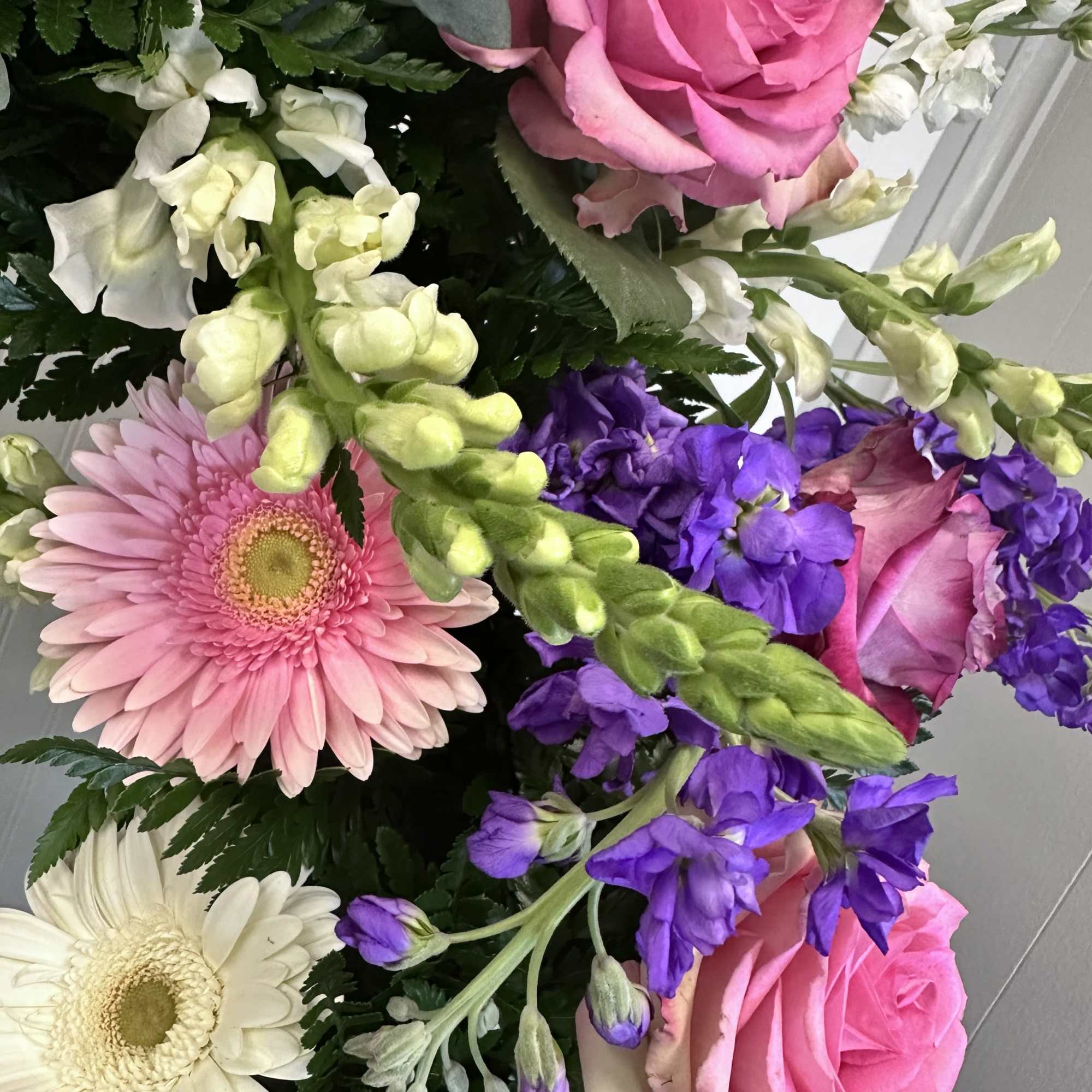 Standing Wreath flowers are subject to substitution.