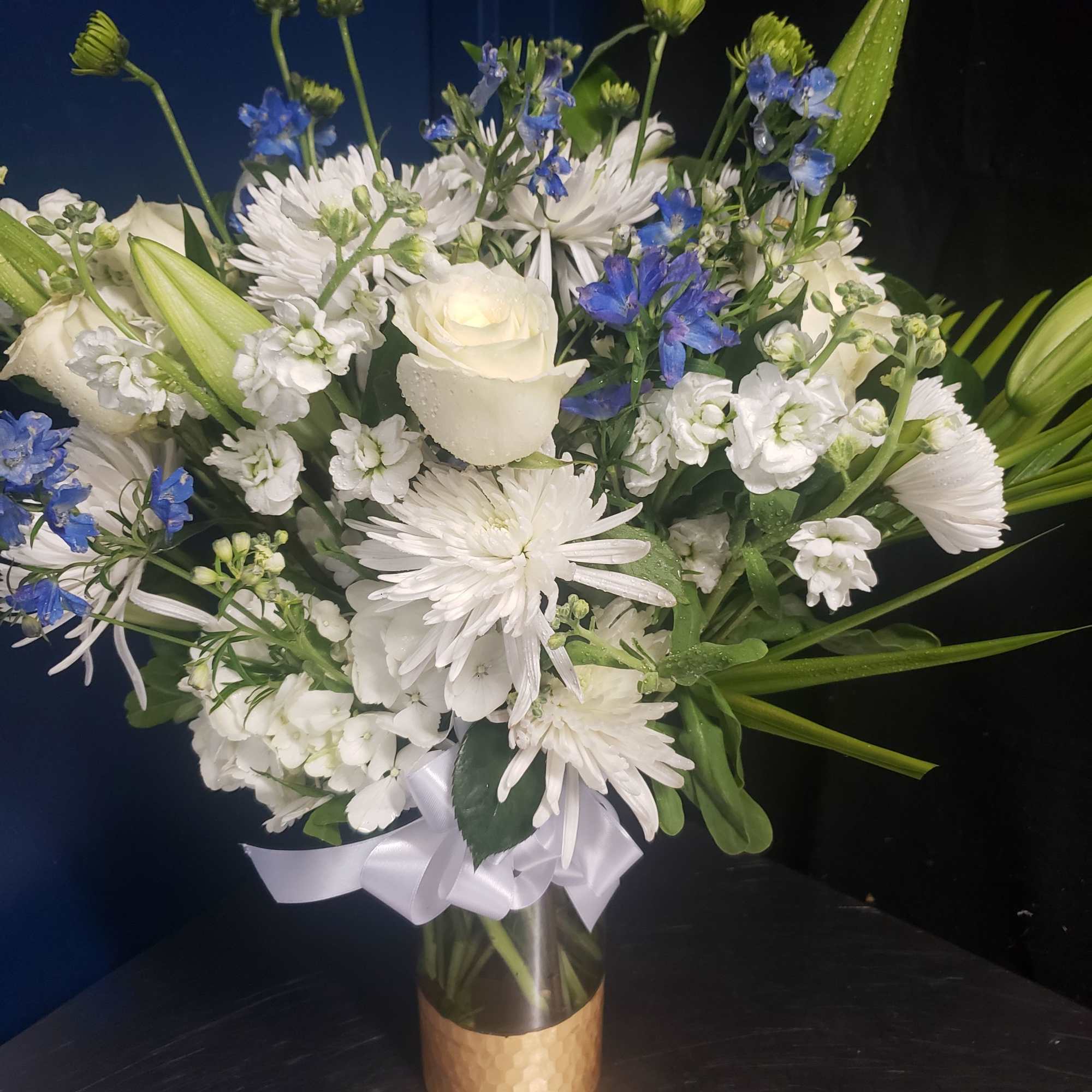 Pure white blooms framed with bright blue accents create a calm, uplifting