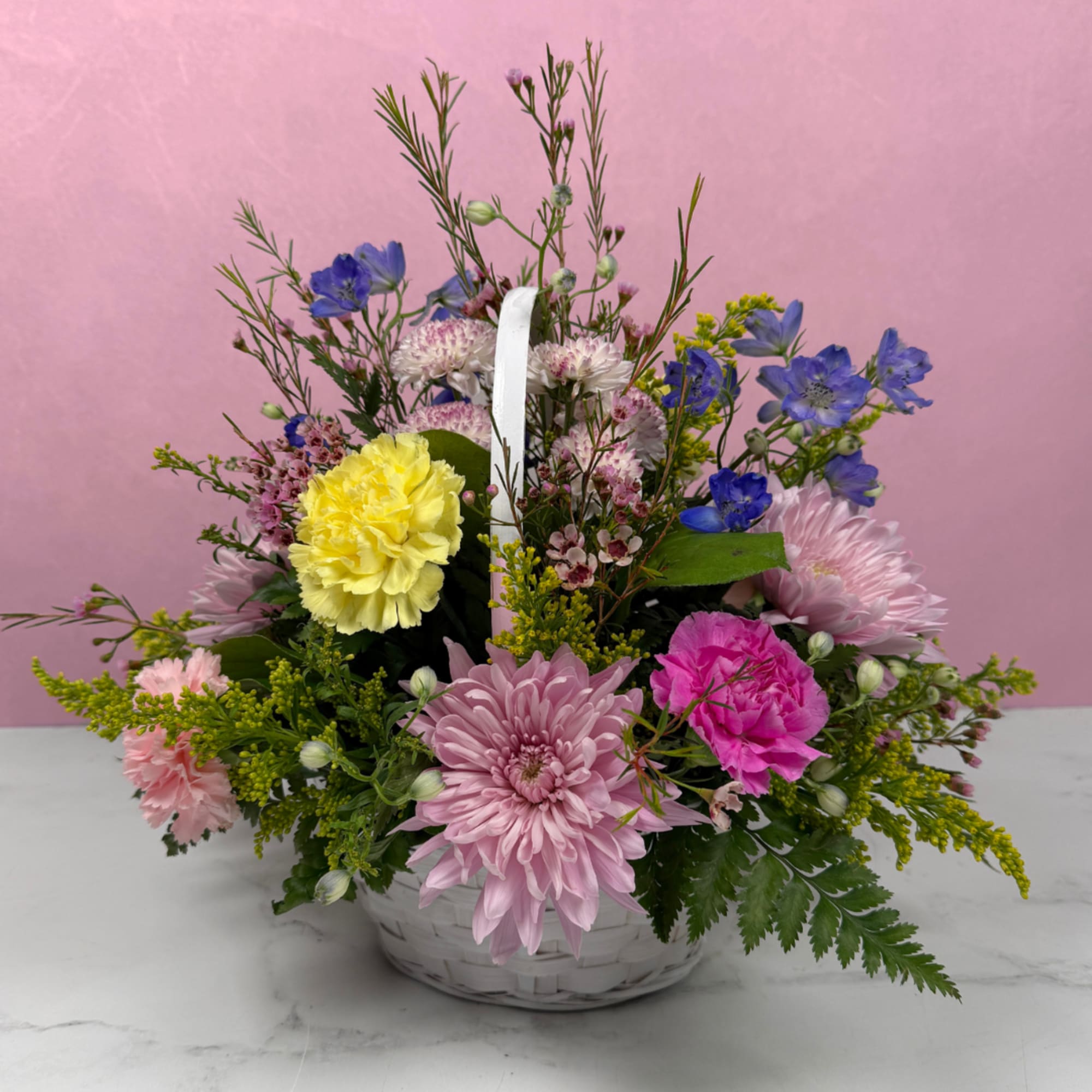 Our Celebrating You Basket is a joyful floral arrangement, a great choice