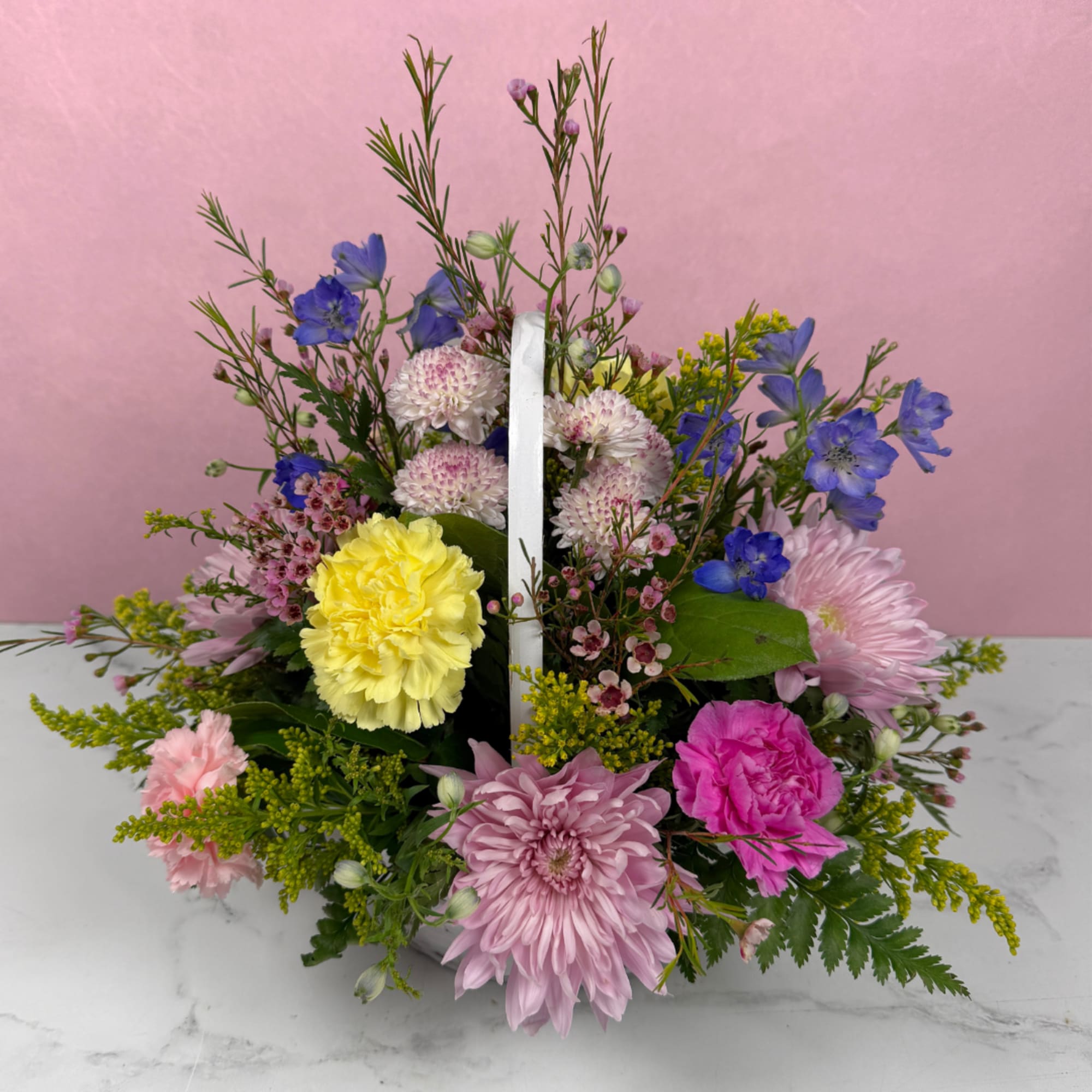 Our Celebrating You Basket is a joyful floral arrangement, a great choice