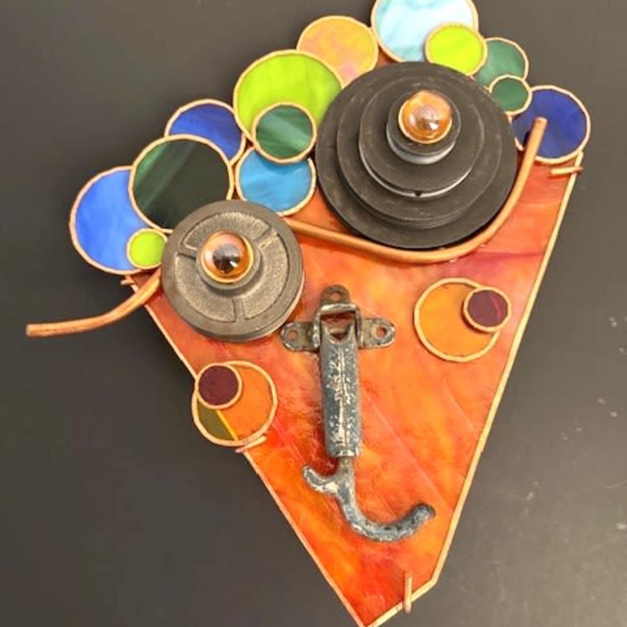 Bright, whimsical and full of color, this wall-mounted flower arrangement alternative makes