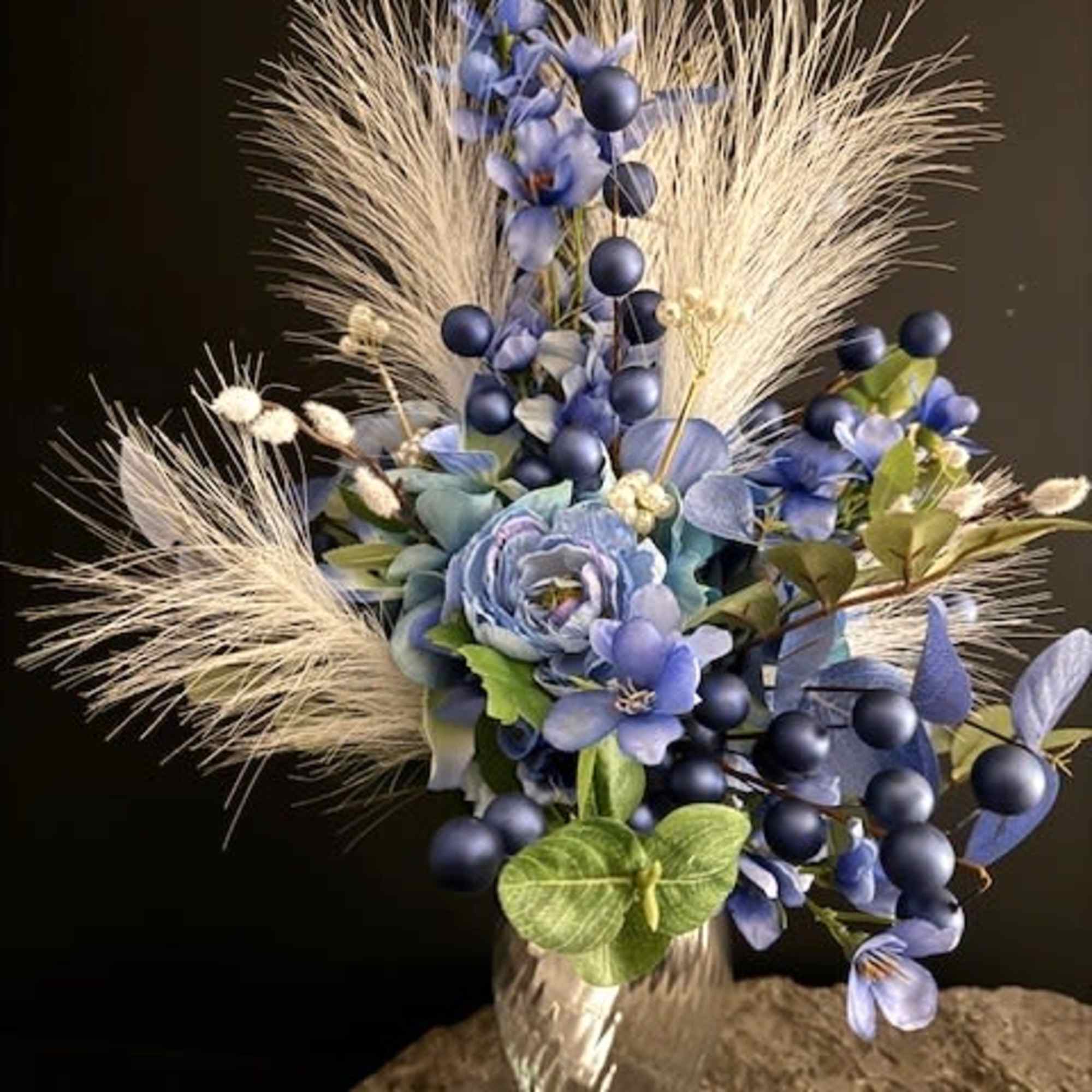 Soft blue hydrangeas and velvety ranunculas form the heart of this silk