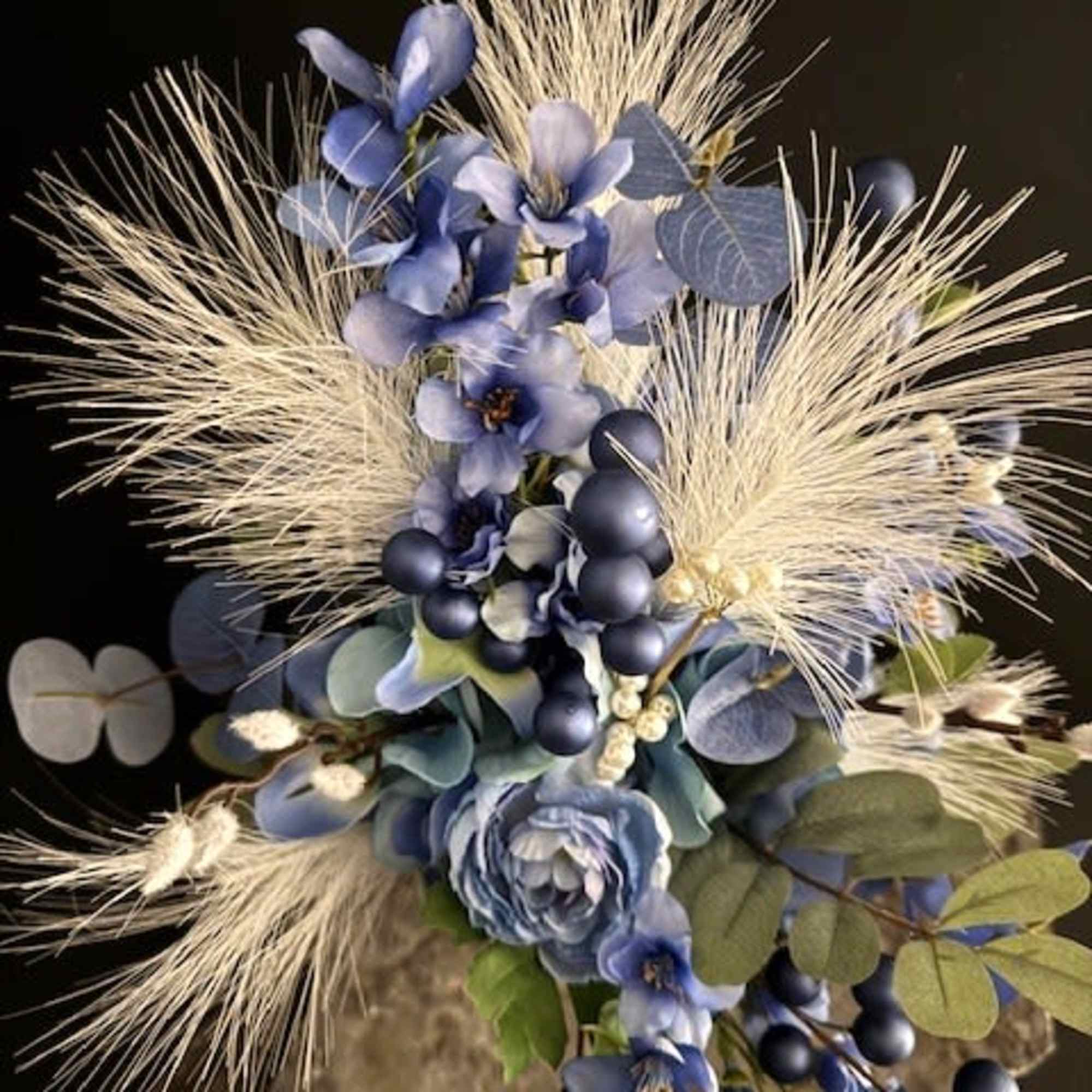 Soft blue hydrangeas and velvety ranunculas form the heart of this silk