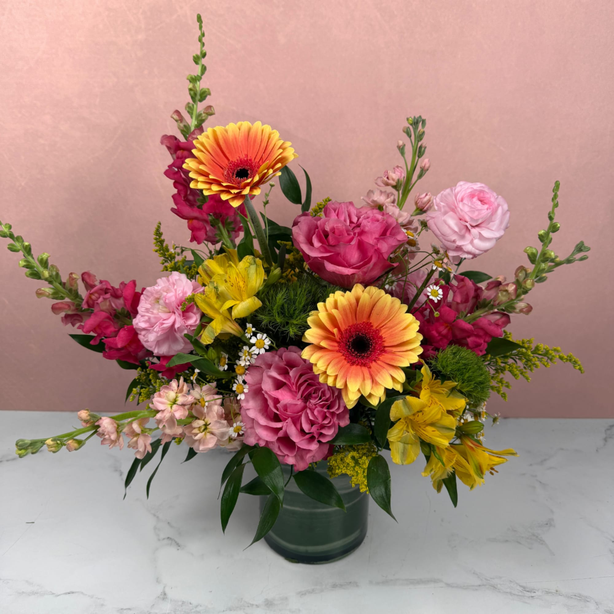 A bold and lively arrangement filled with bright, colorful blooms that feel