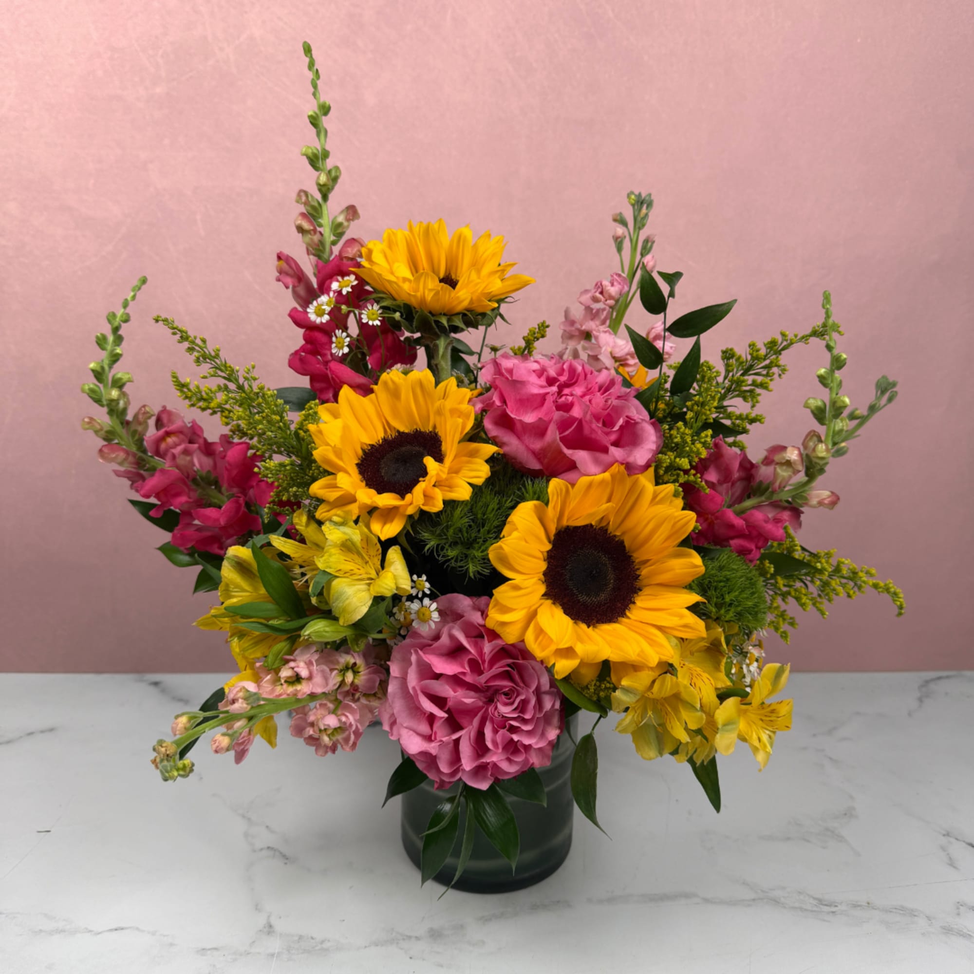 A bold and lively arrangement filled with bright, colorful blooms that feel