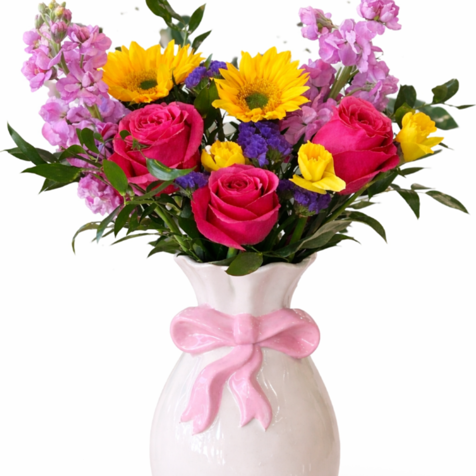 Bright mixed bouquet with pink roses, yellow sunflowers and purple blooms in a white vase with pink bow
