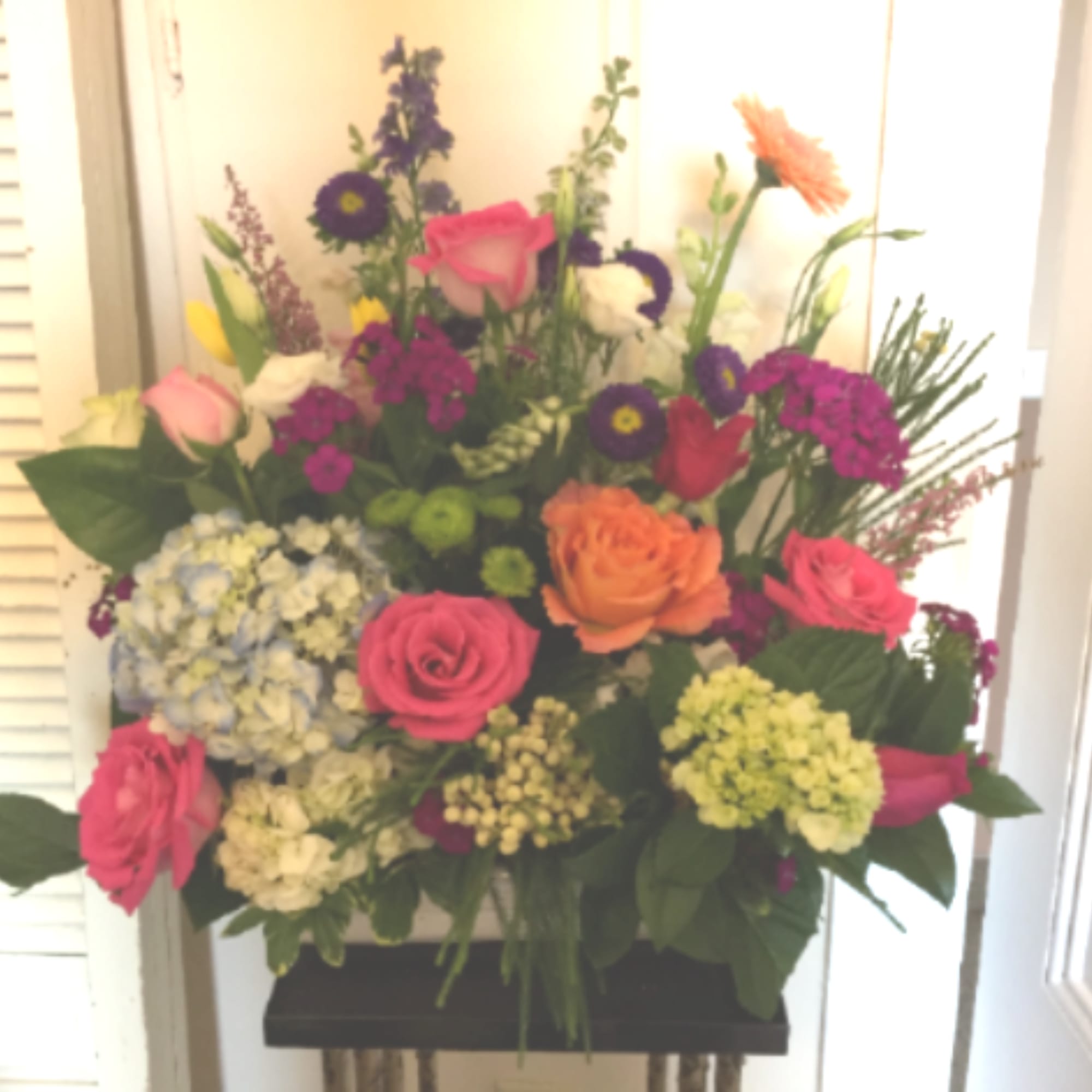 orange garden roses, mini gerbera daisies, green mini hydrangea