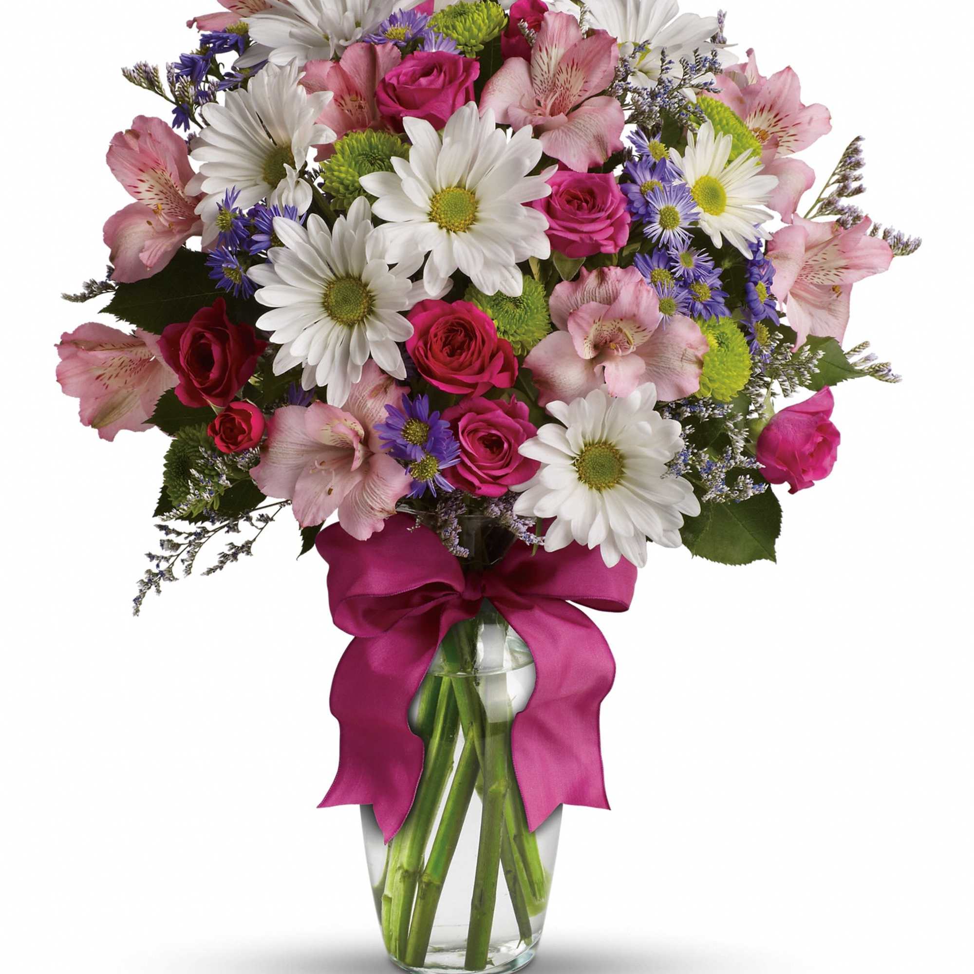 Mixed bouquet of pink roses, white daisies, and alstroemeria in a glass vase