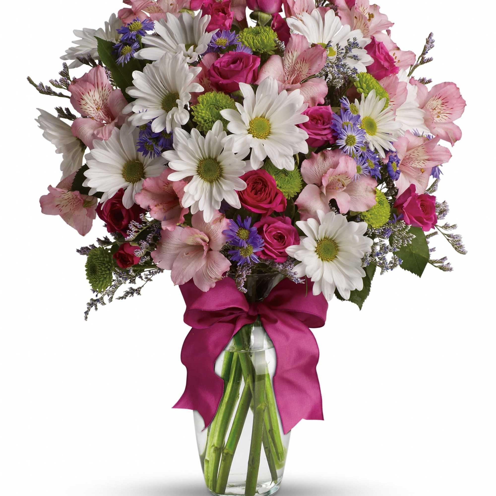 Bouquet of pink and white flowers in a glass vase with a magenta ribbon