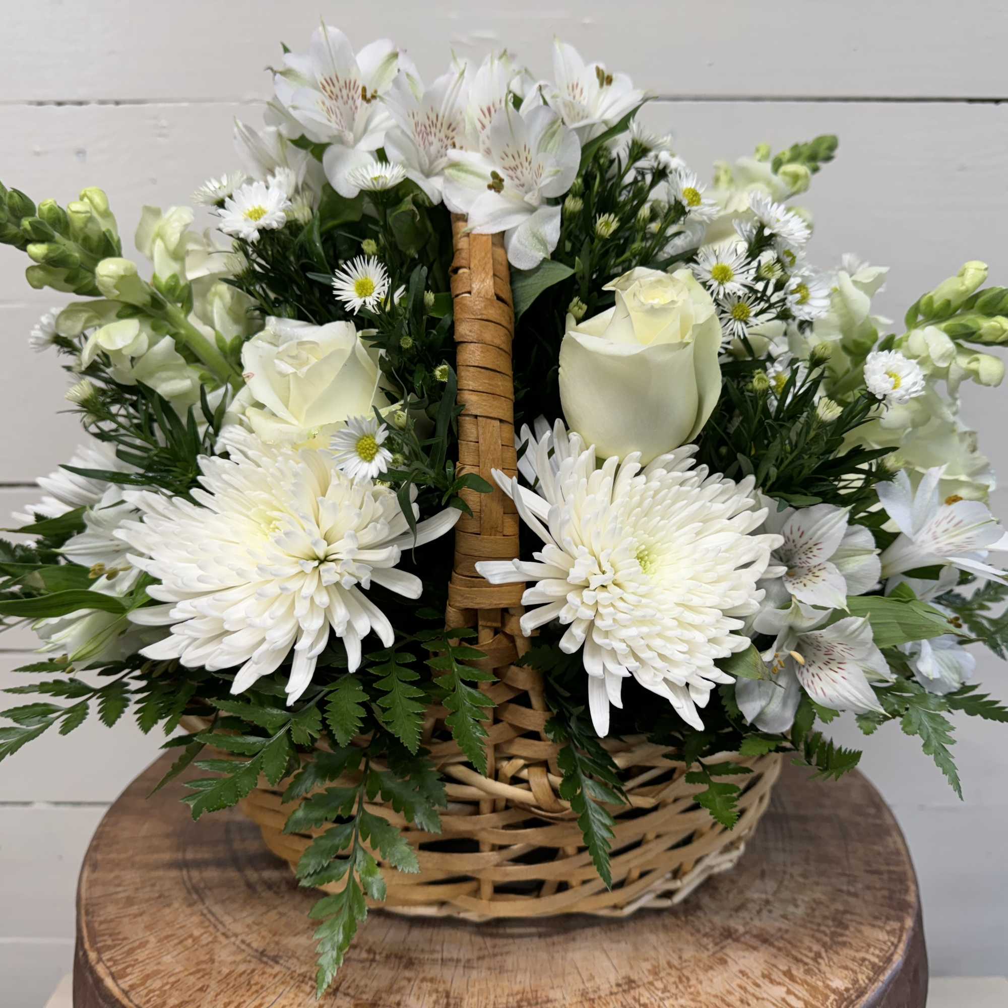 White flowers arranged in a wicker basket