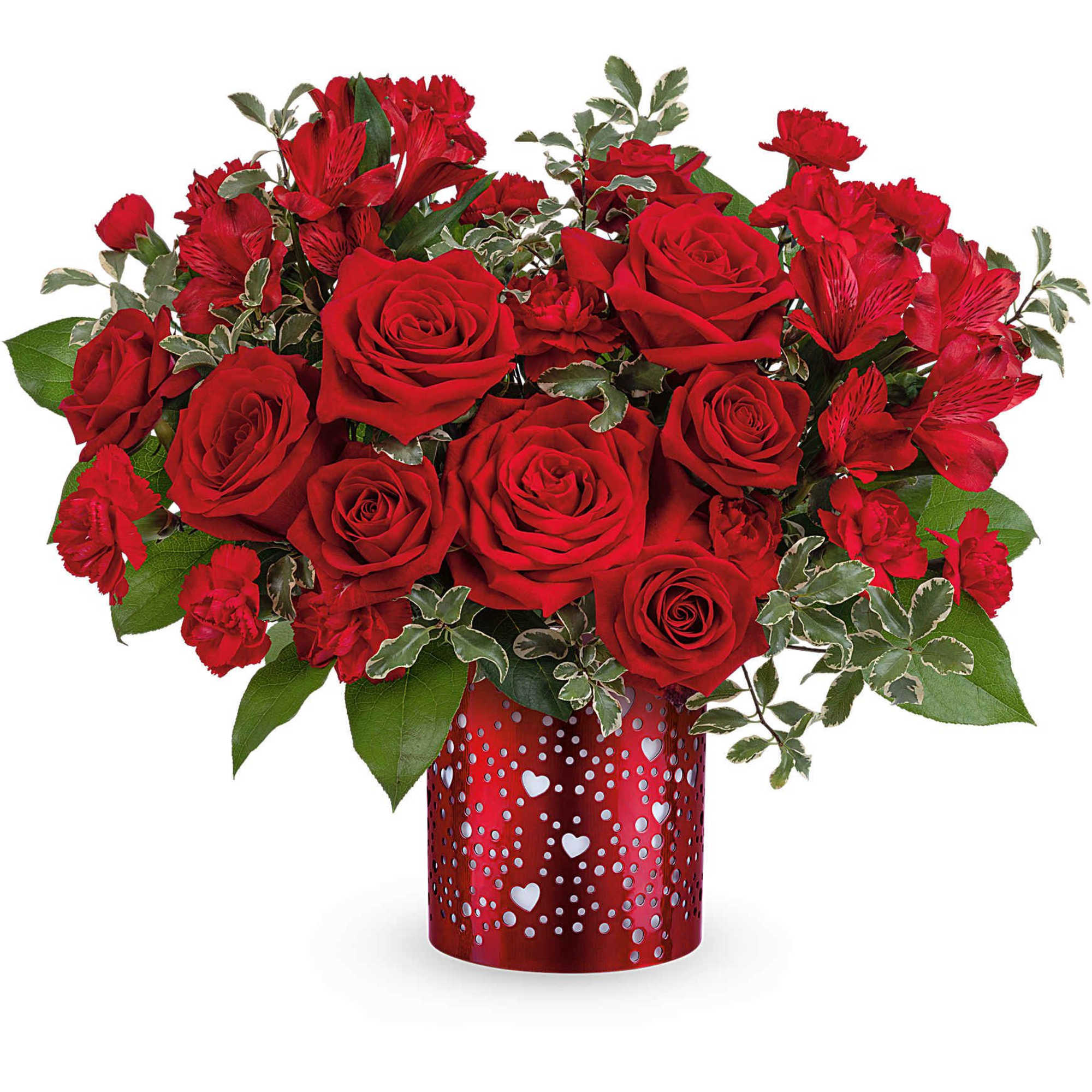 Red roses and carnations in a red heart-patterned vase