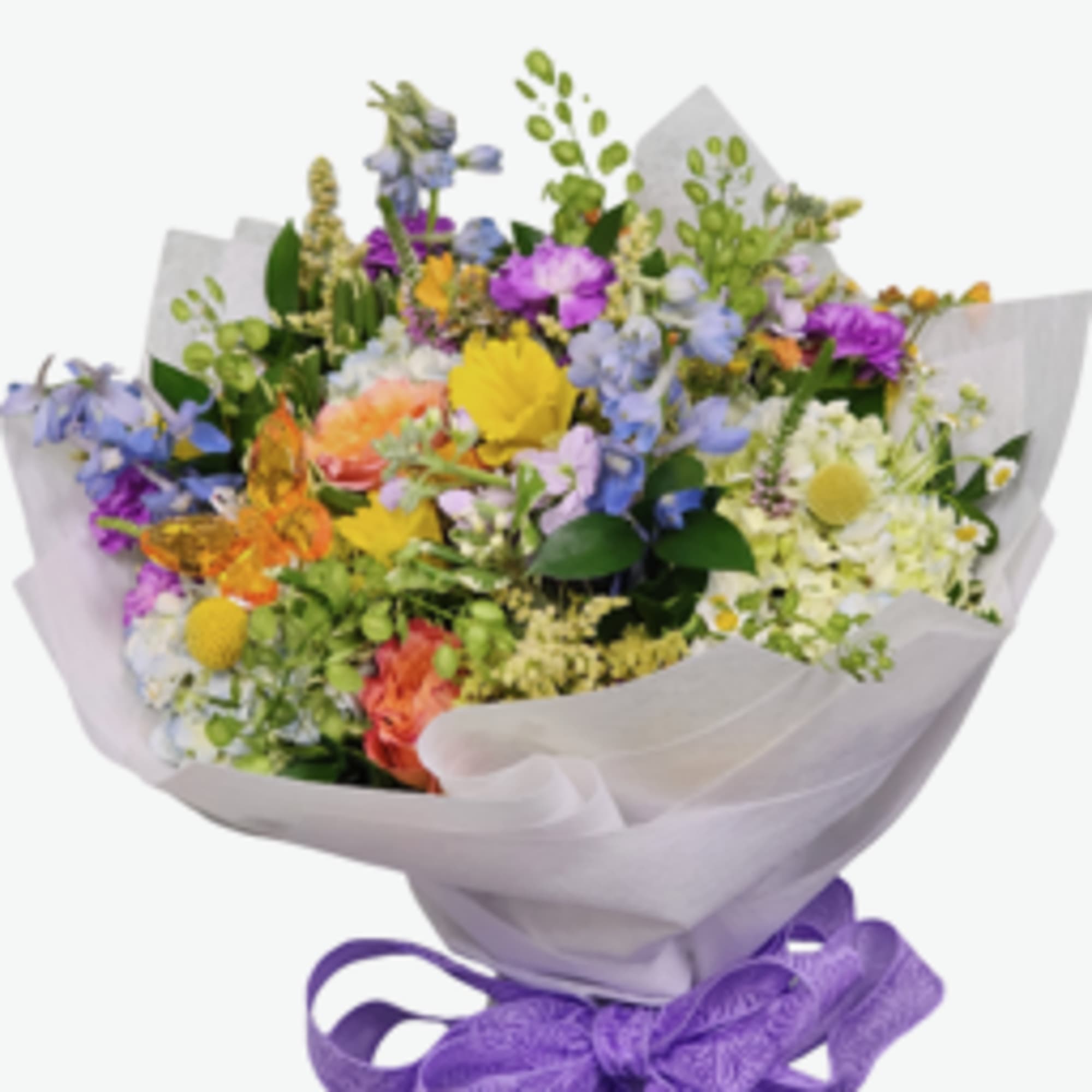 A sweet seasonal cello wrapped bouquet filled with fresh blooms in a