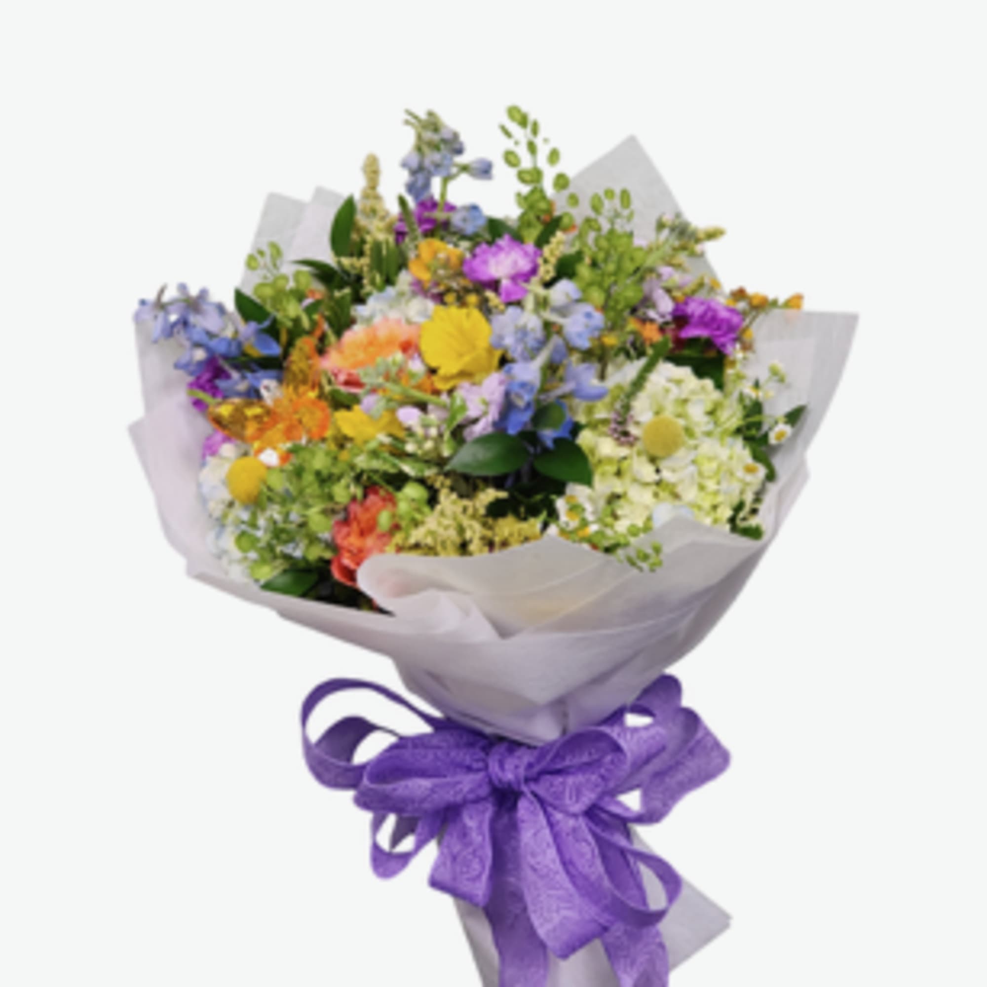 A sweet seasonal cello wrapped bouquet filled with fresh blooms in a
