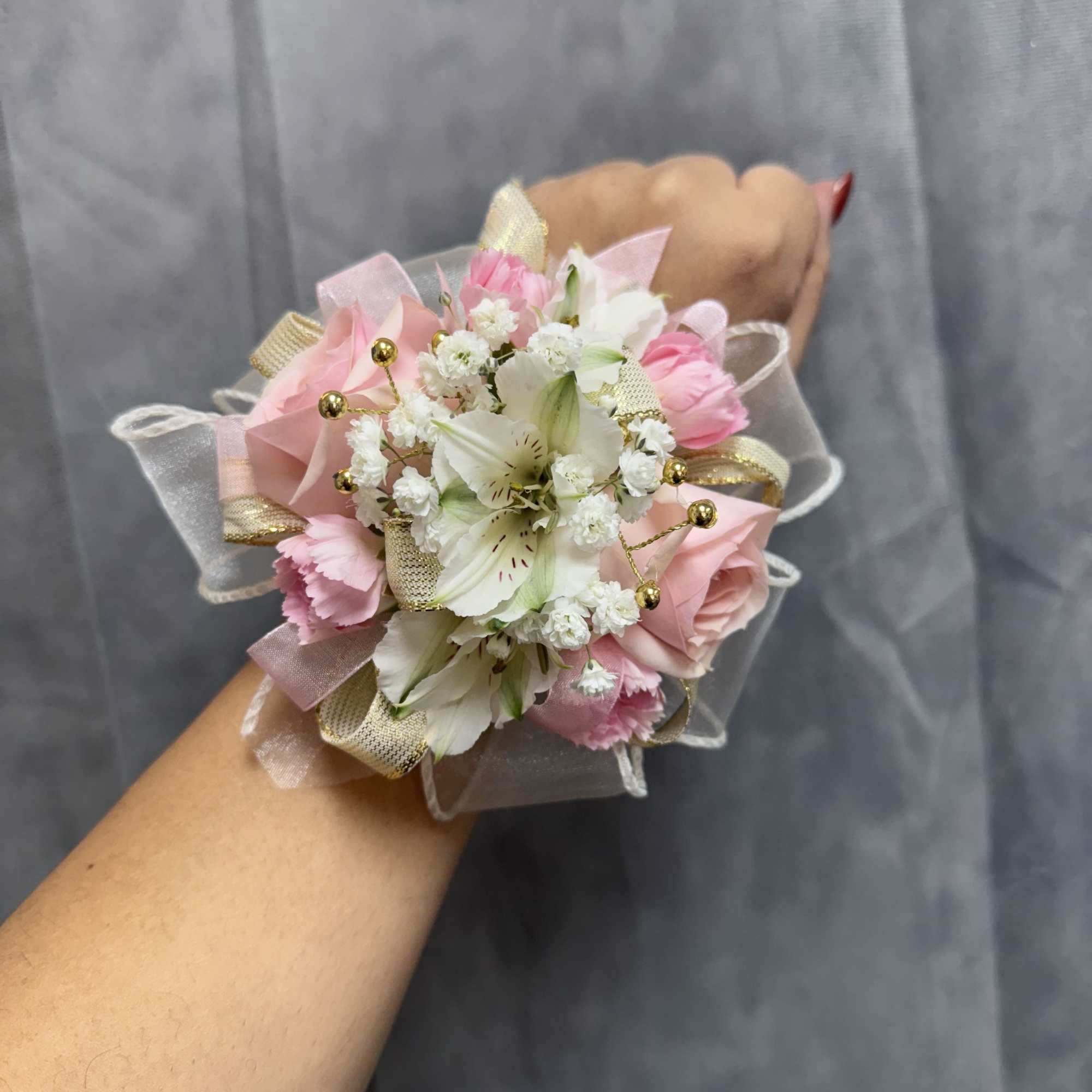 White pink gold corsage , made with white alstroemeria, pink spray roses