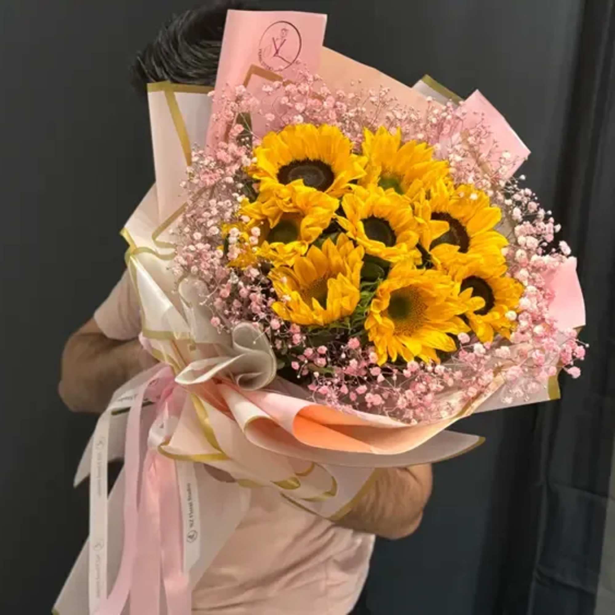 This cheerful bouquet features 10 glowing sunflowers, symbolizing happiness, warmth, and positivity.