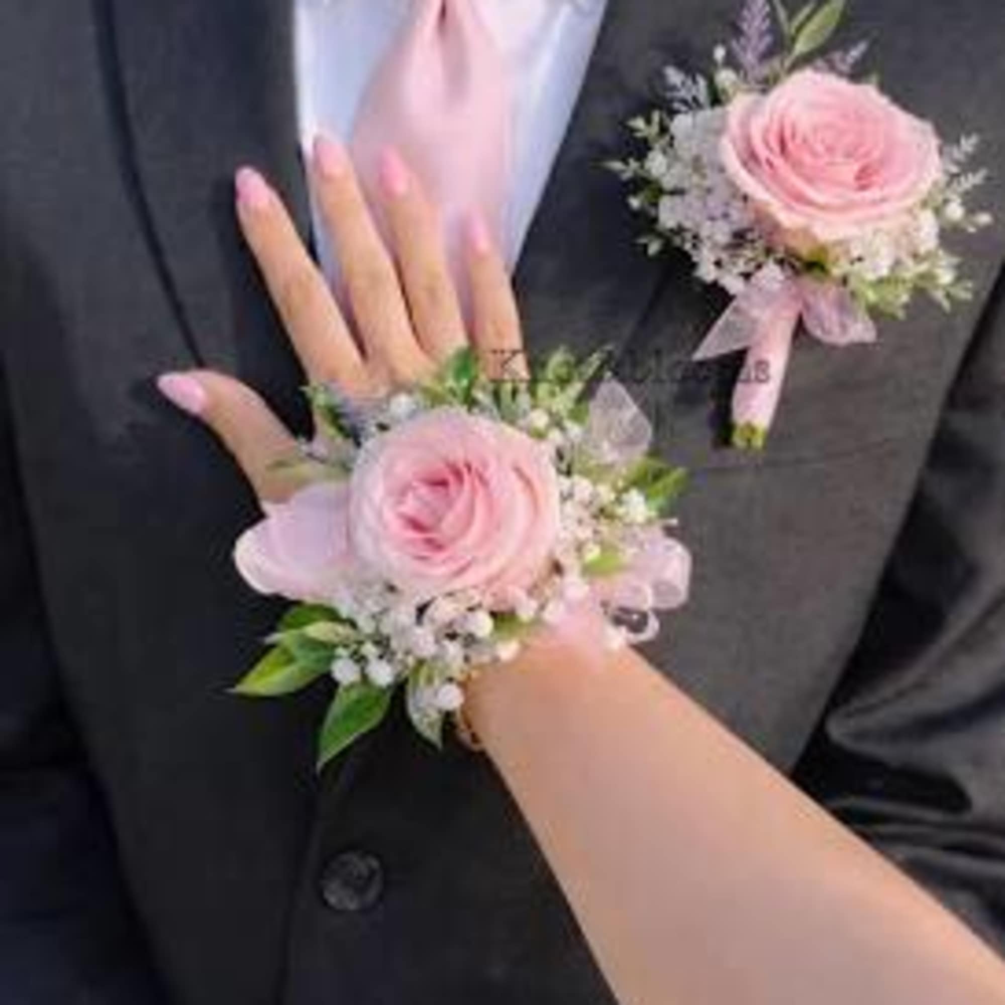Elegant matching corsage and boutonniere set, perfect for proms, weddings, and special