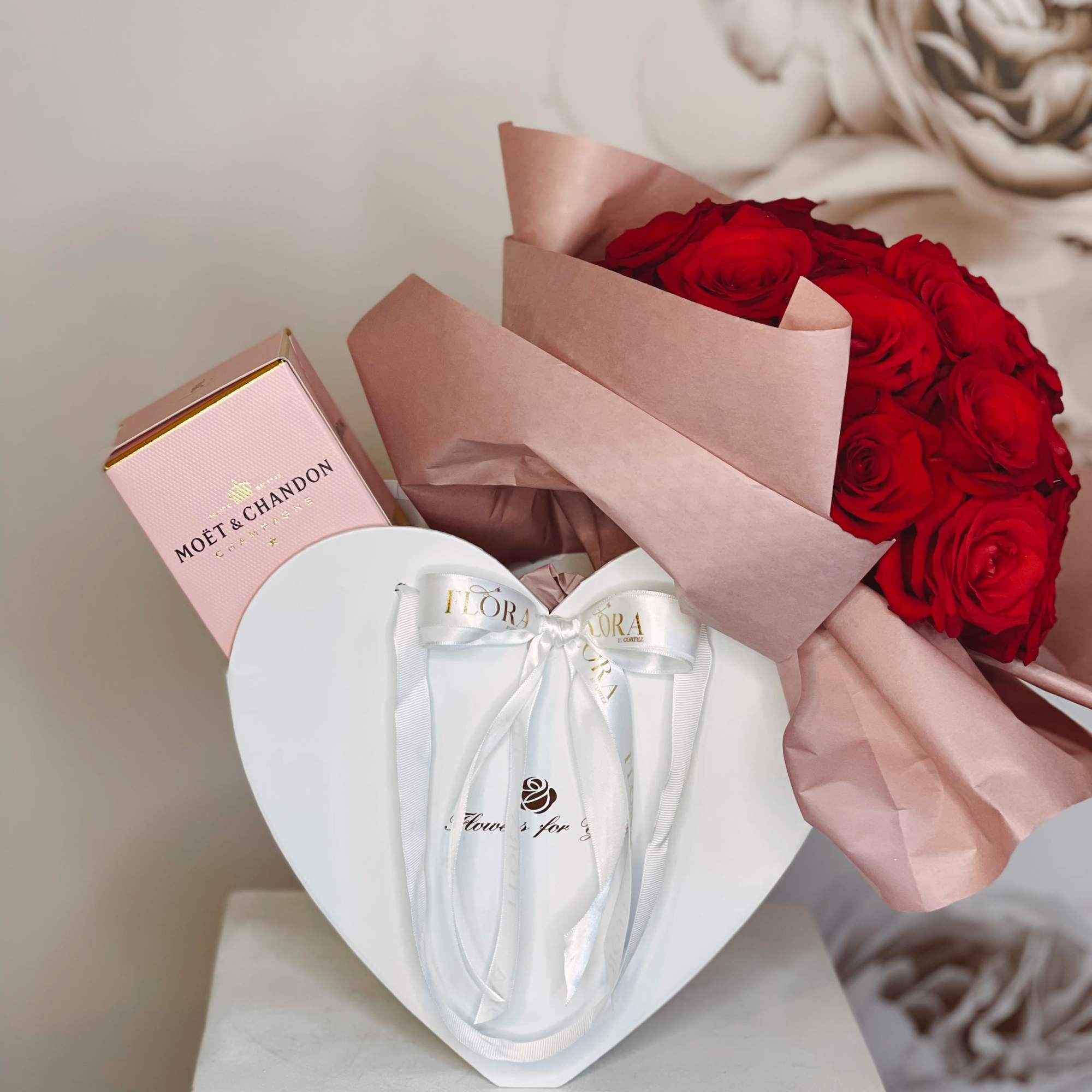 Red rose bouquet with a pink champagne box and white heart gift box