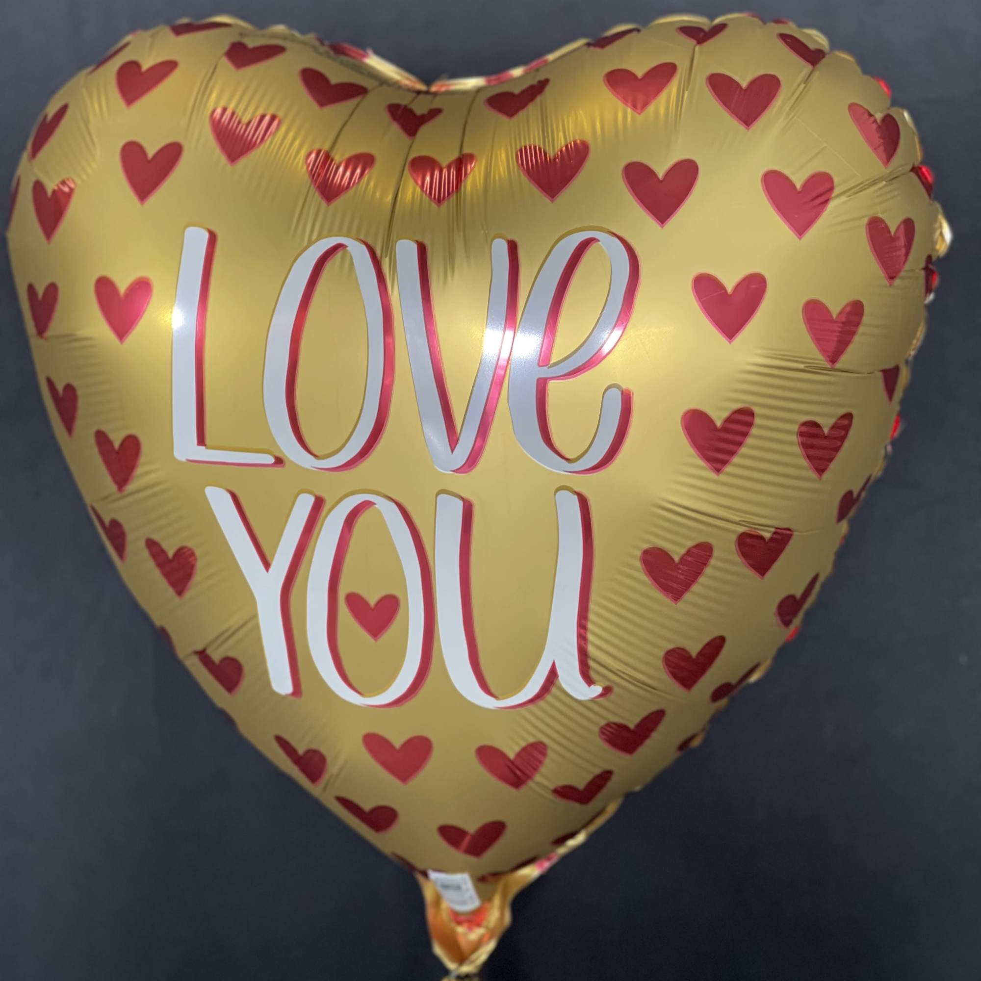 Express your love with the Love You Gold Heart Balloon, a perfect