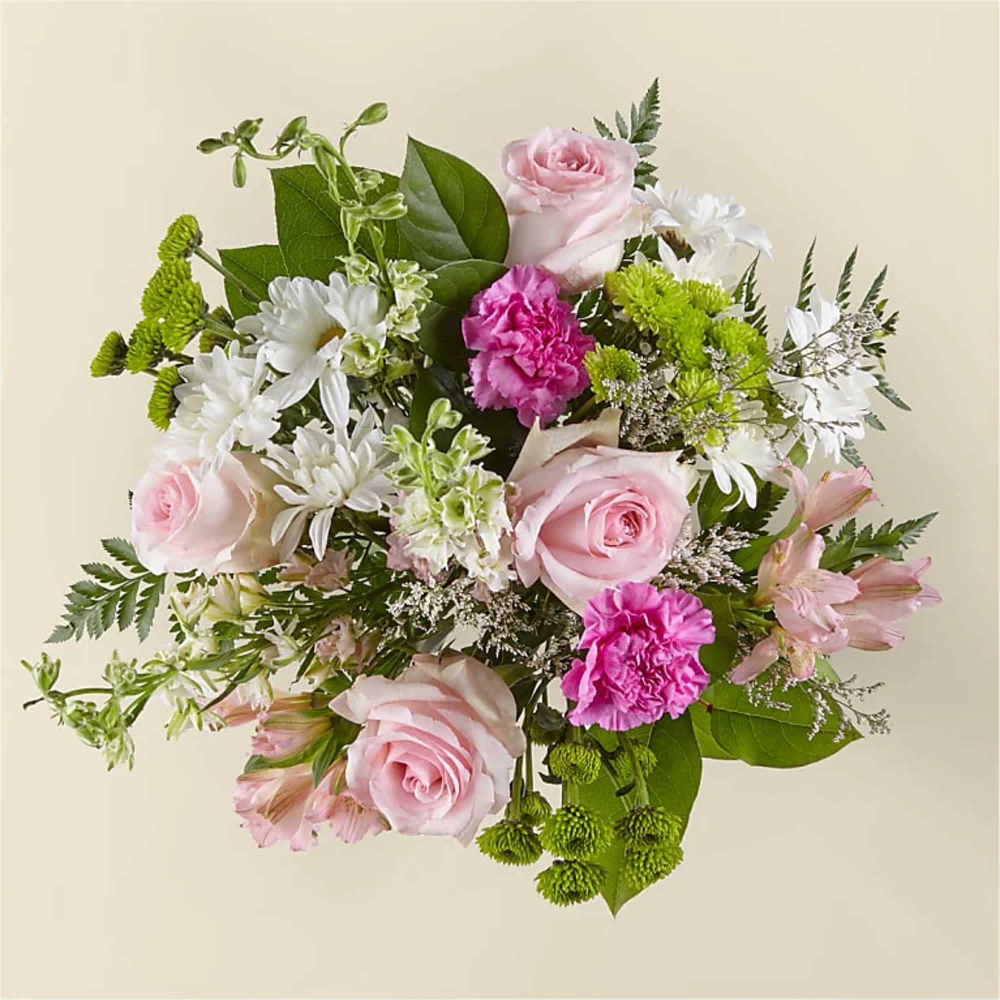 Bouquet of pink roses, white daisies, and magenta carnations