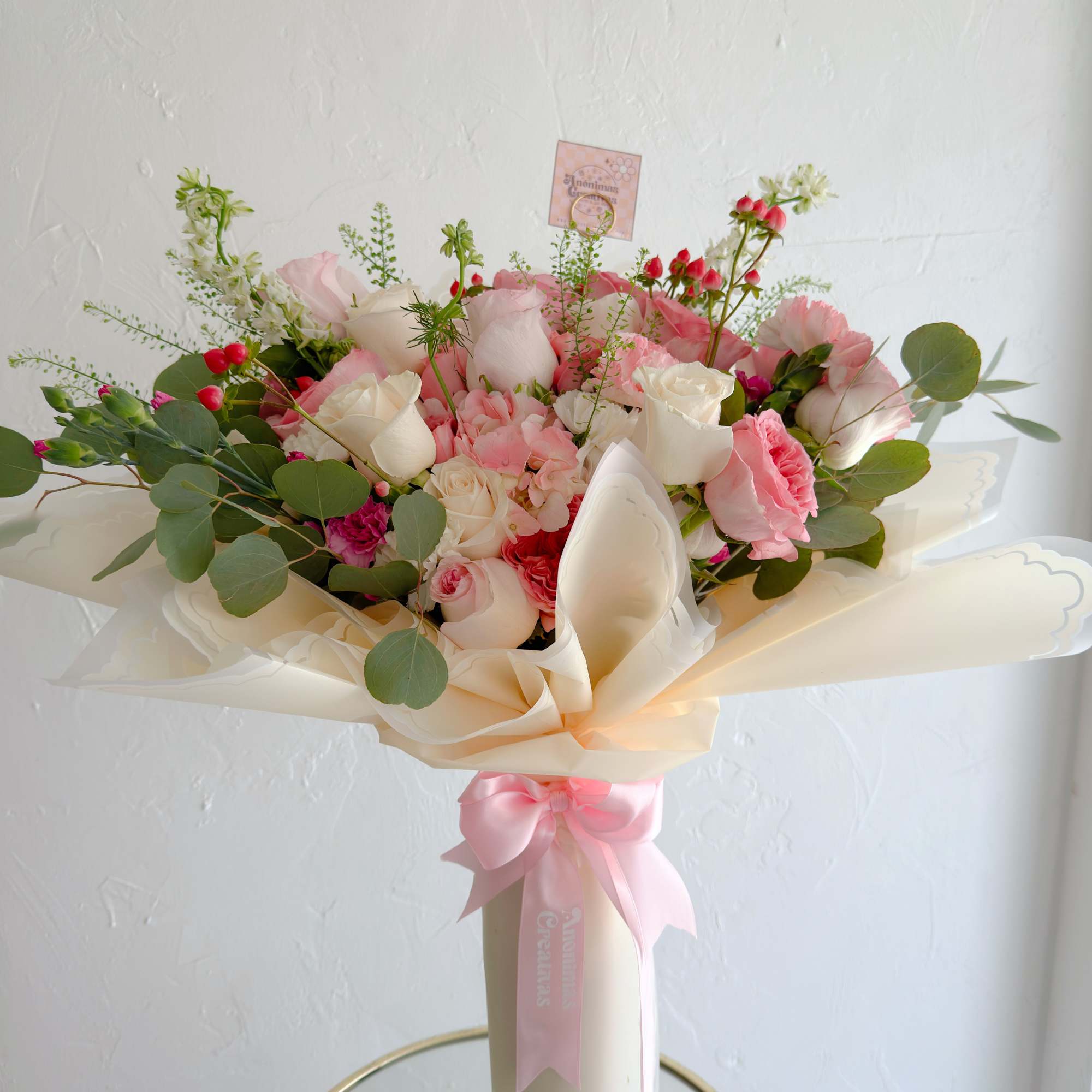 Elegant and romantic bouquet featuring a soft mix of blush and white